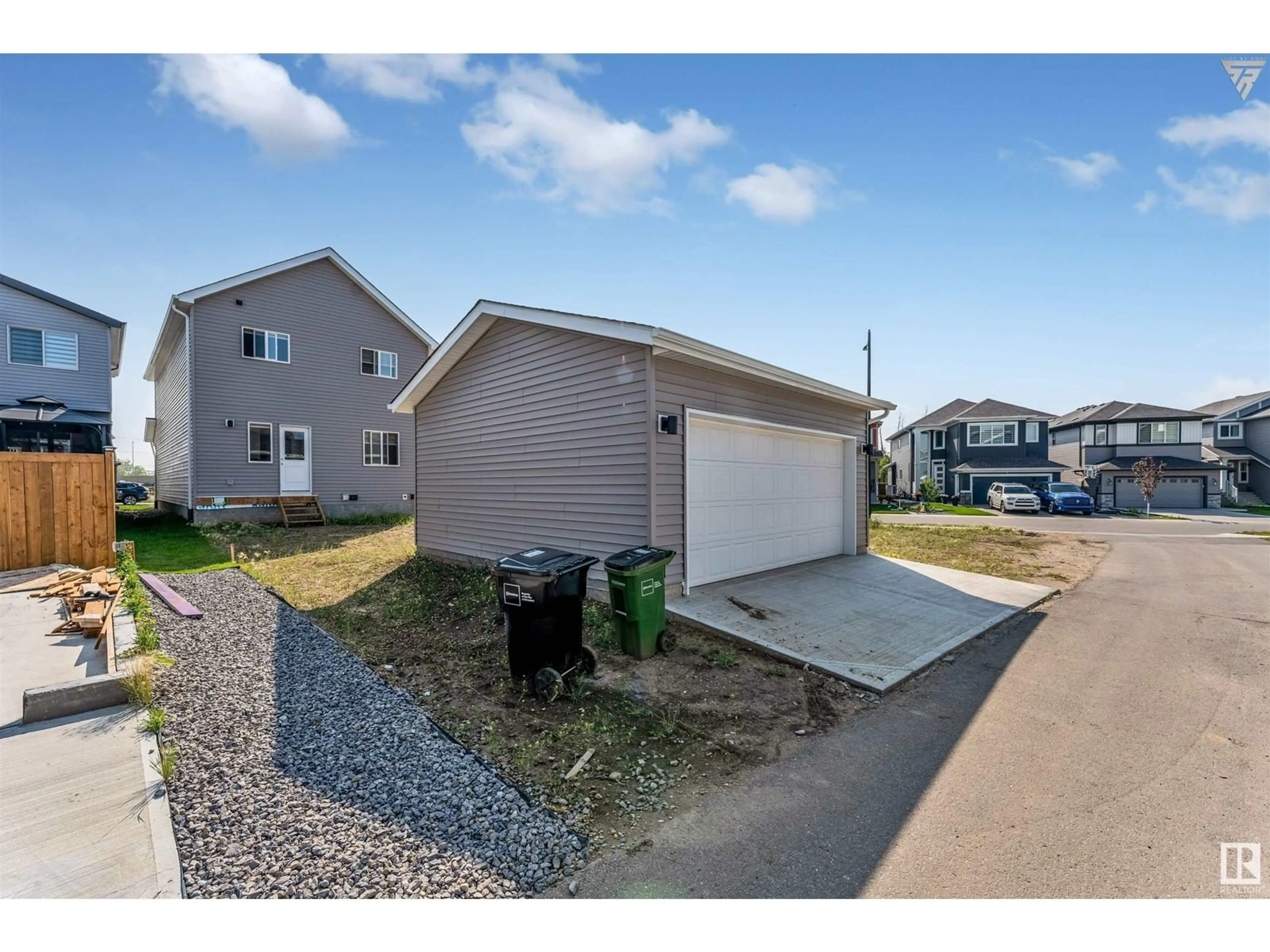 A pic from exterior of the house or condo, the fenced backyard for 3504 4 ST NW, Edmonton Alberta T6T2P8