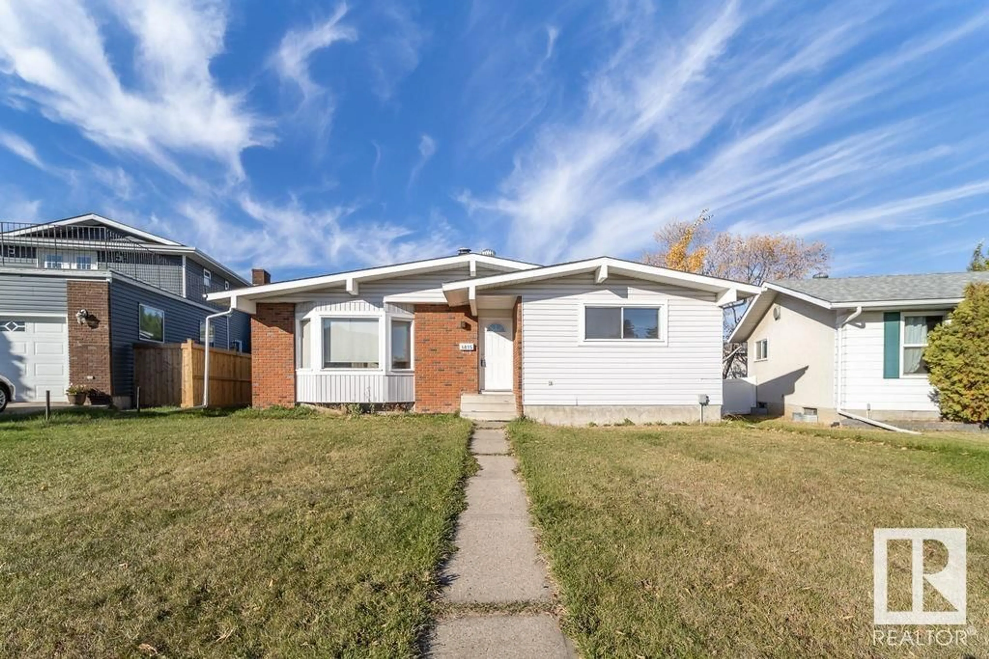 Frontside or backside of a home, the fenced backyard for 6835 39 AV NW, Edmonton Alberta T6K2N6