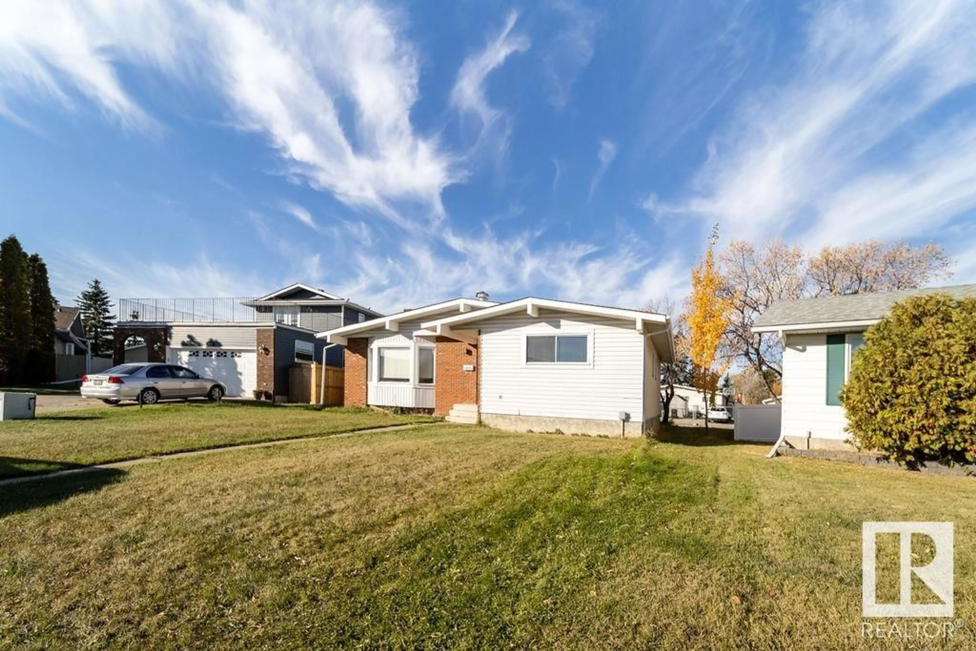 Frontside or backside of a home, the fenced backyard for 6835 39 AV NW, Edmonton Alberta T6K2N6