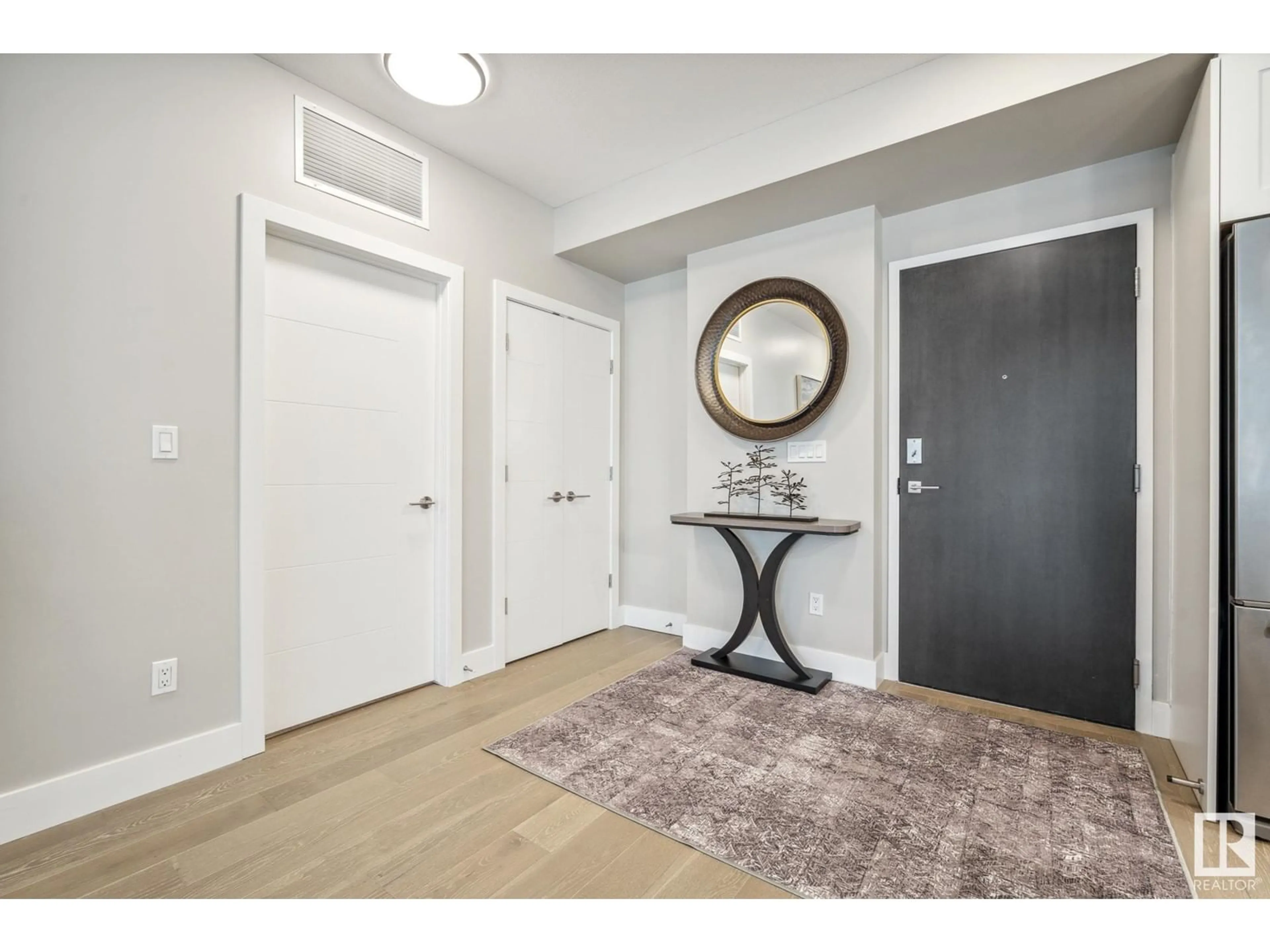 Indoor entryway, wood floors for #107 200 BELLEROSE DR, St. Albert Alberta T8N7P7