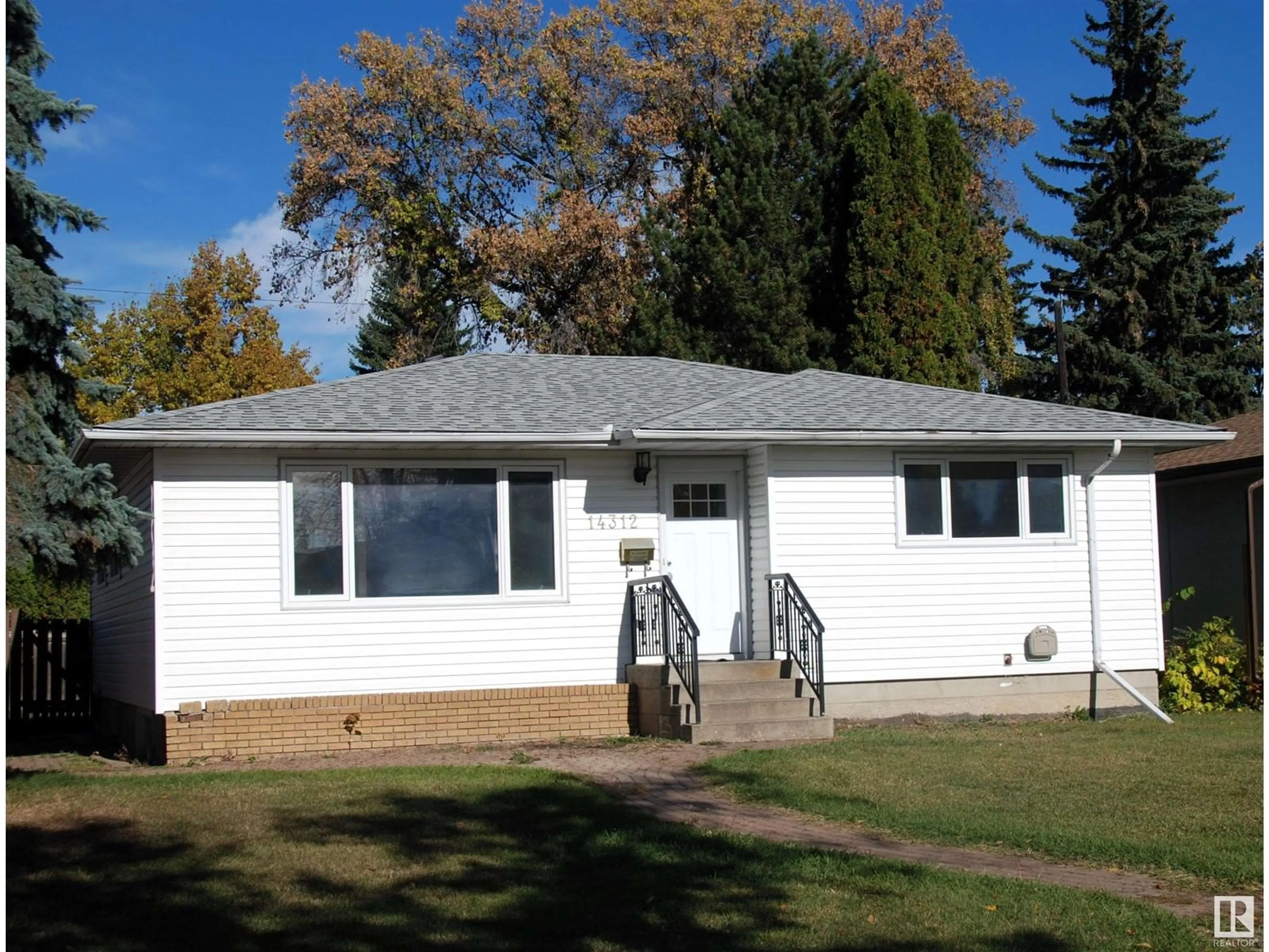 Frontside or backside of a home, the front or back of building for 14312 87 AV NW, Edmonton Alberta T5R4E2