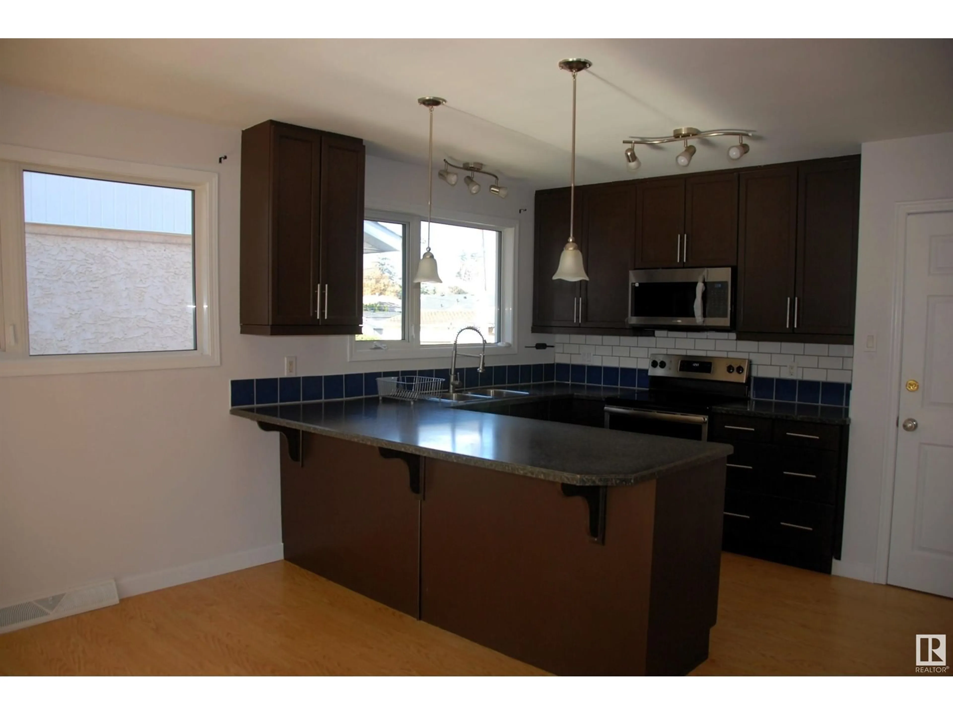 Open concept kitchen for 14312 87 AV NW, Edmonton Alberta T5R4E2