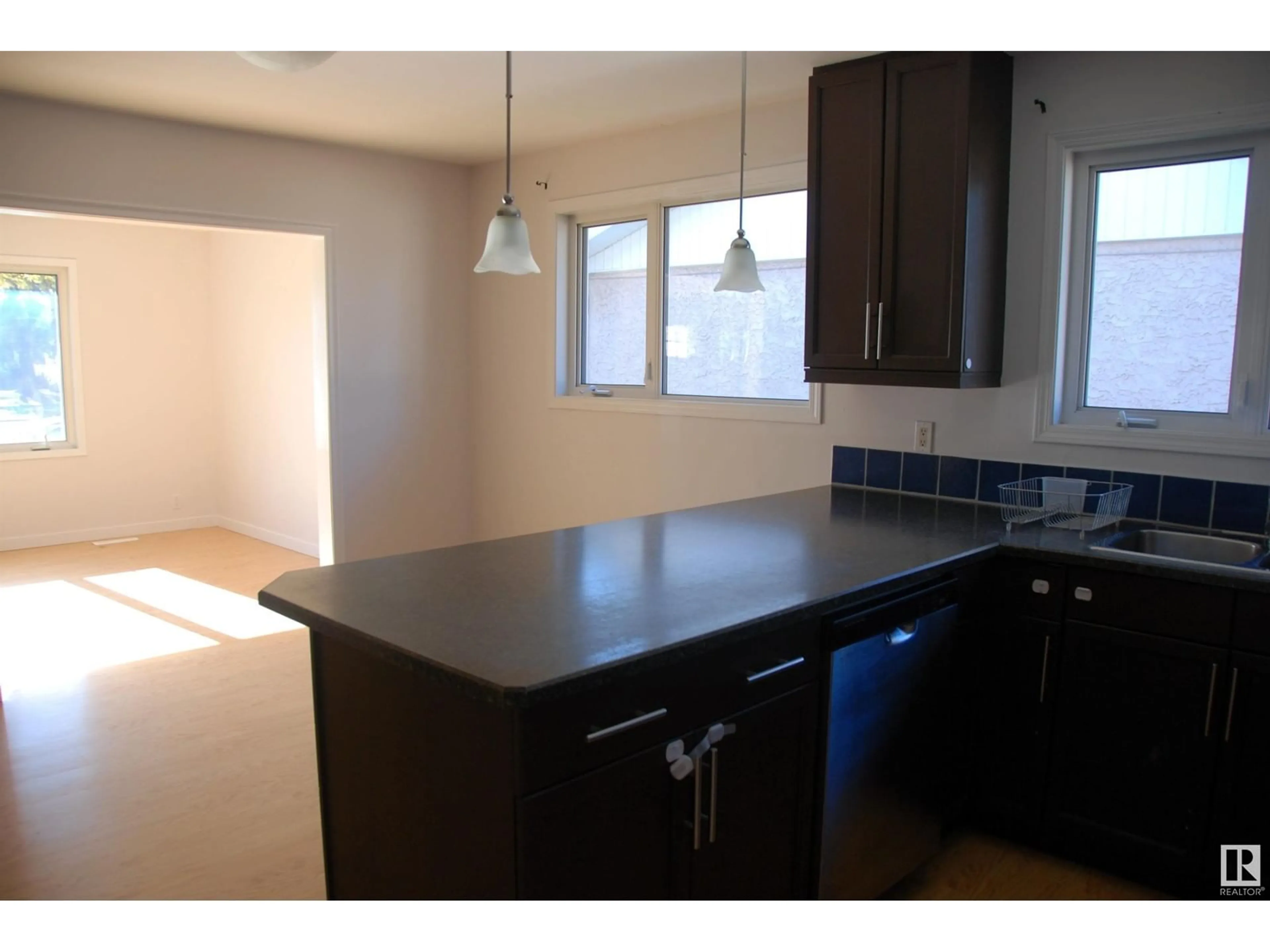 Open concept kitchen for 14312 87 AV NW, Edmonton Alberta T5R4E2