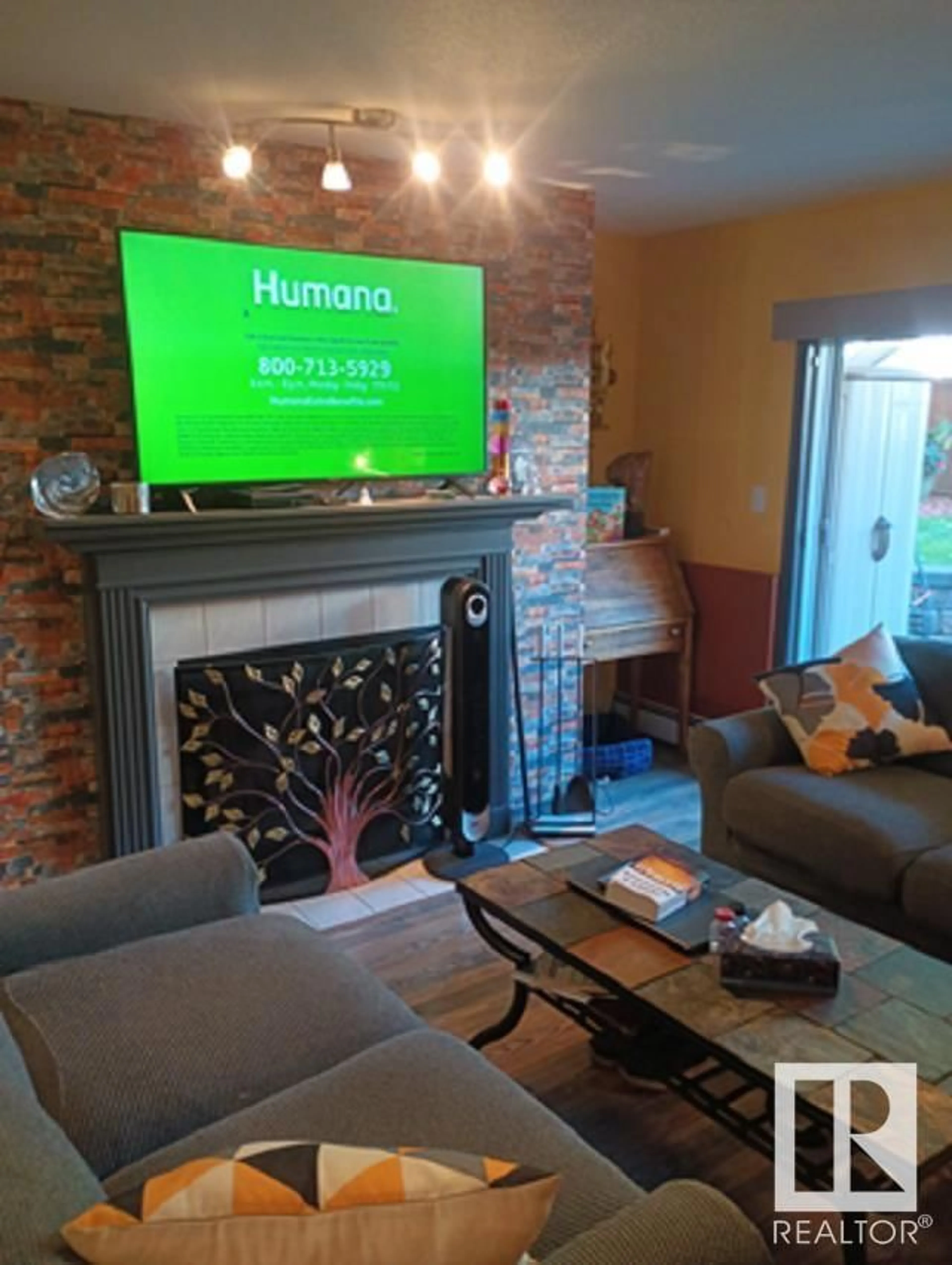 Living room, wood floors for #114 9010 106 AV NW, Edmonton Alberta T5H4K3