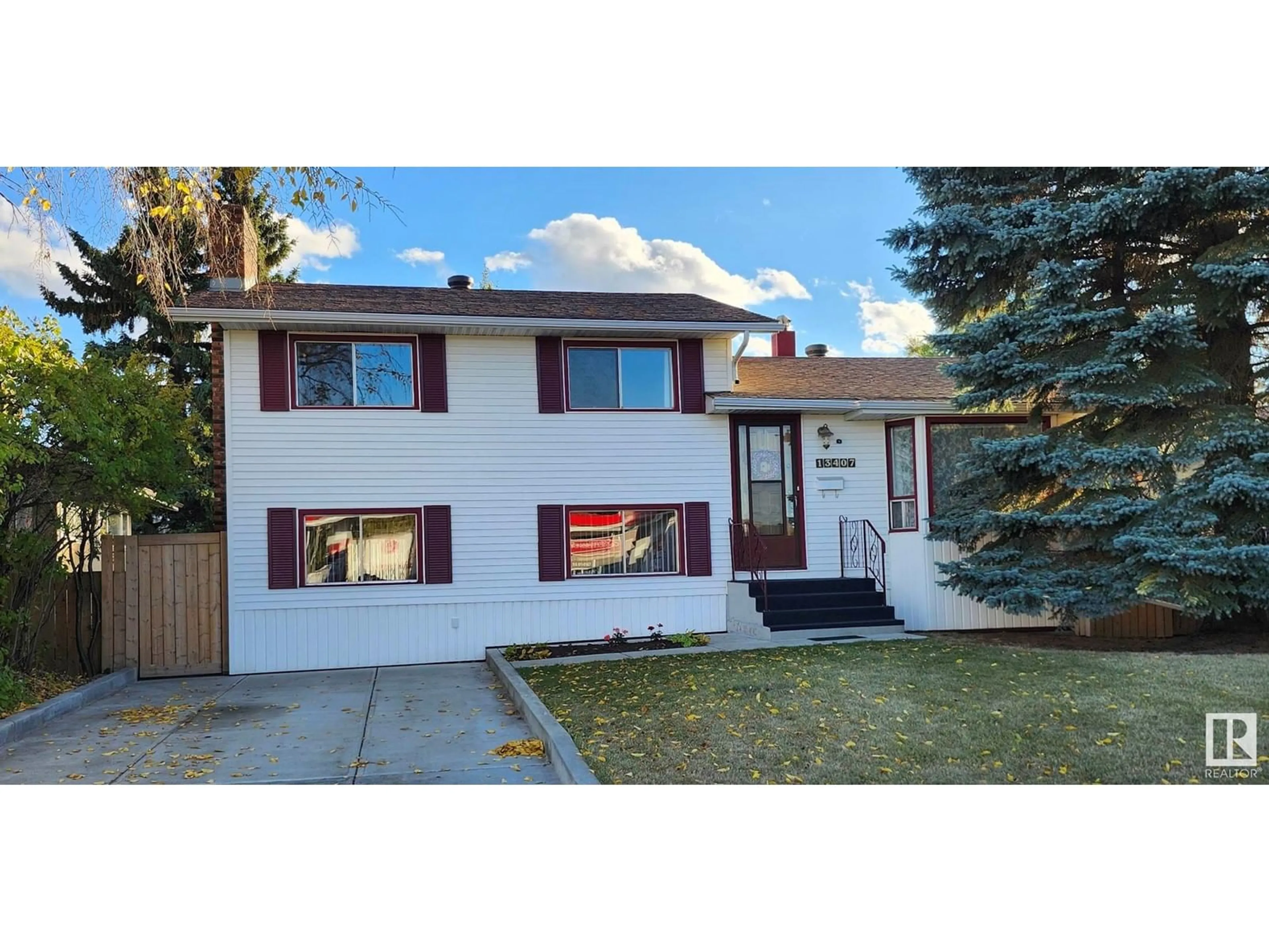 Frontside or backside of a home, the fenced backyard for 13407 118 AV NW, Edmonton Alberta T5L2L7