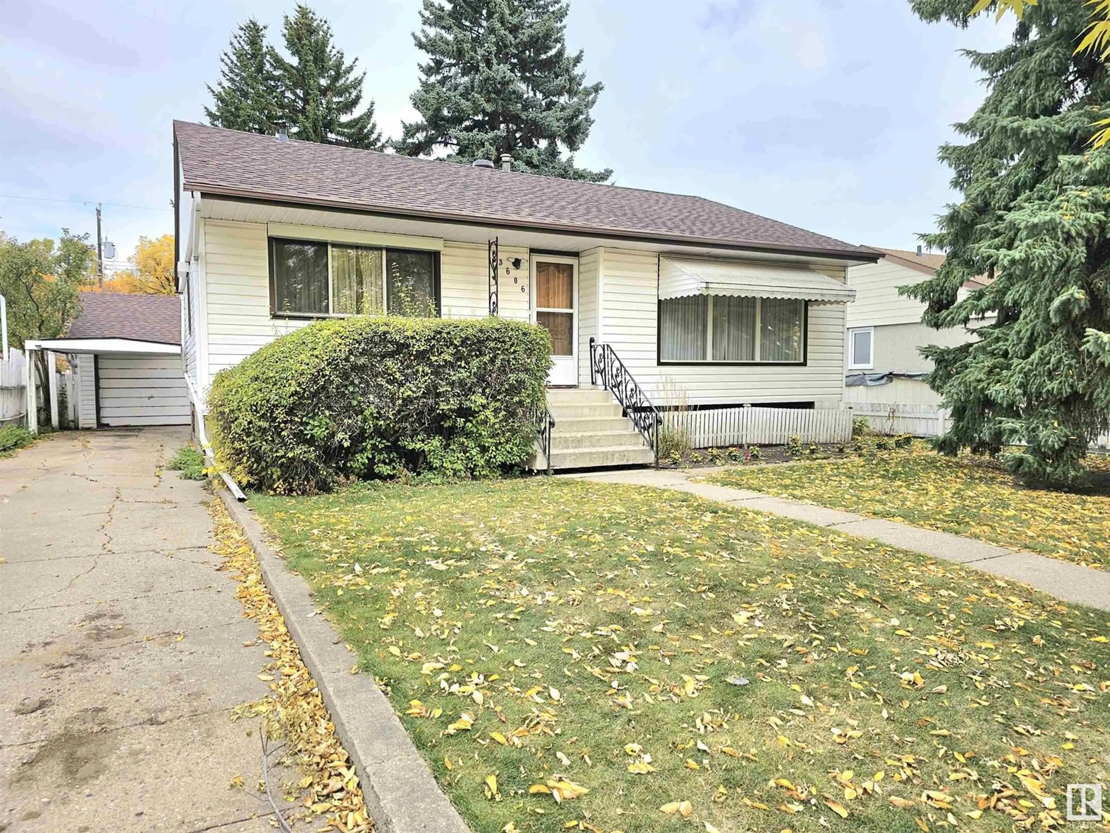 Frontside or backside of a home, the street view for 3606 112 AV NW, Edmonton Alberta T5W0M4