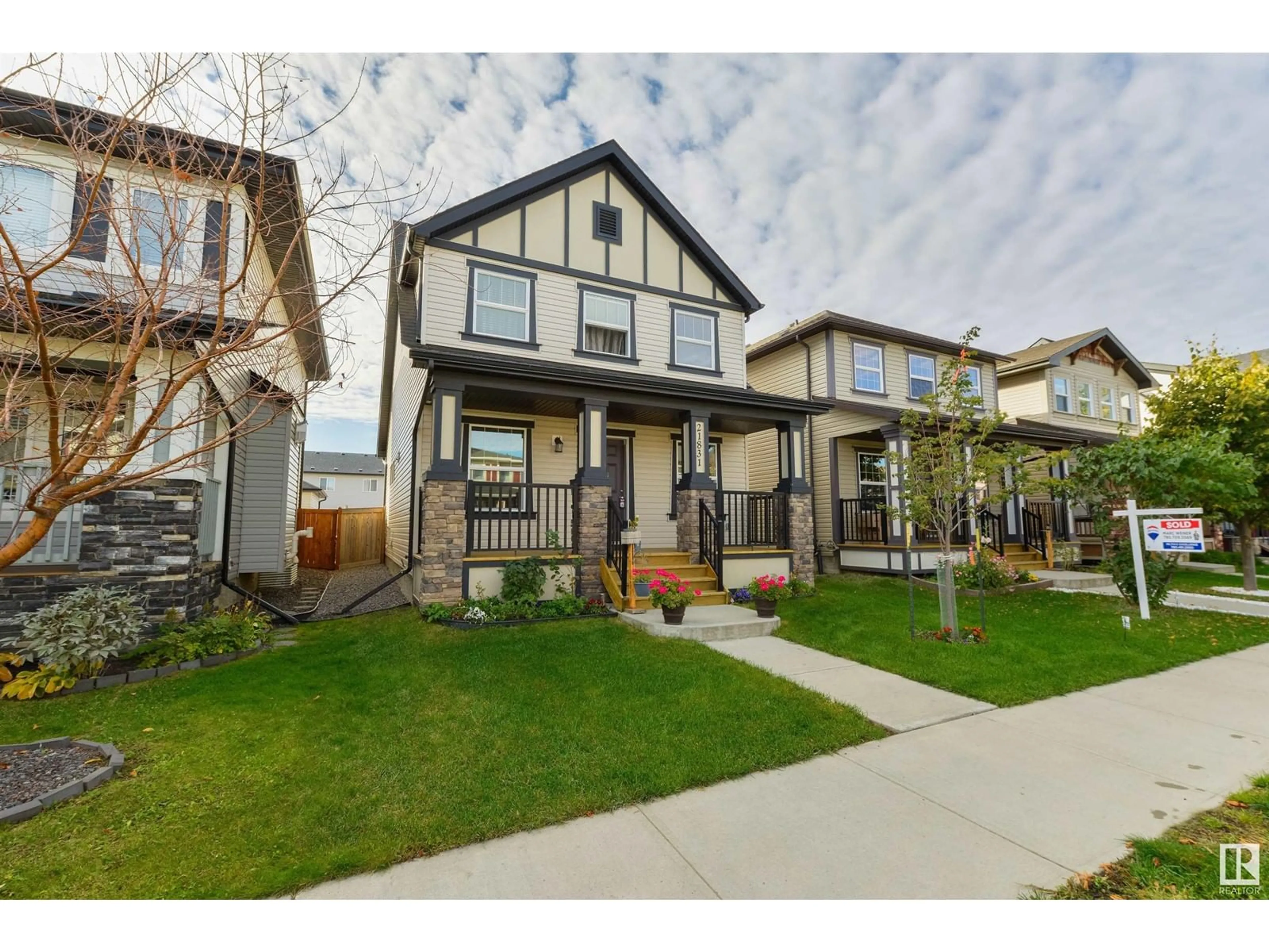 Frontside or backside of a home, the fenced backyard for 21831 99 AV NW, Edmonton Alberta T5T4M5