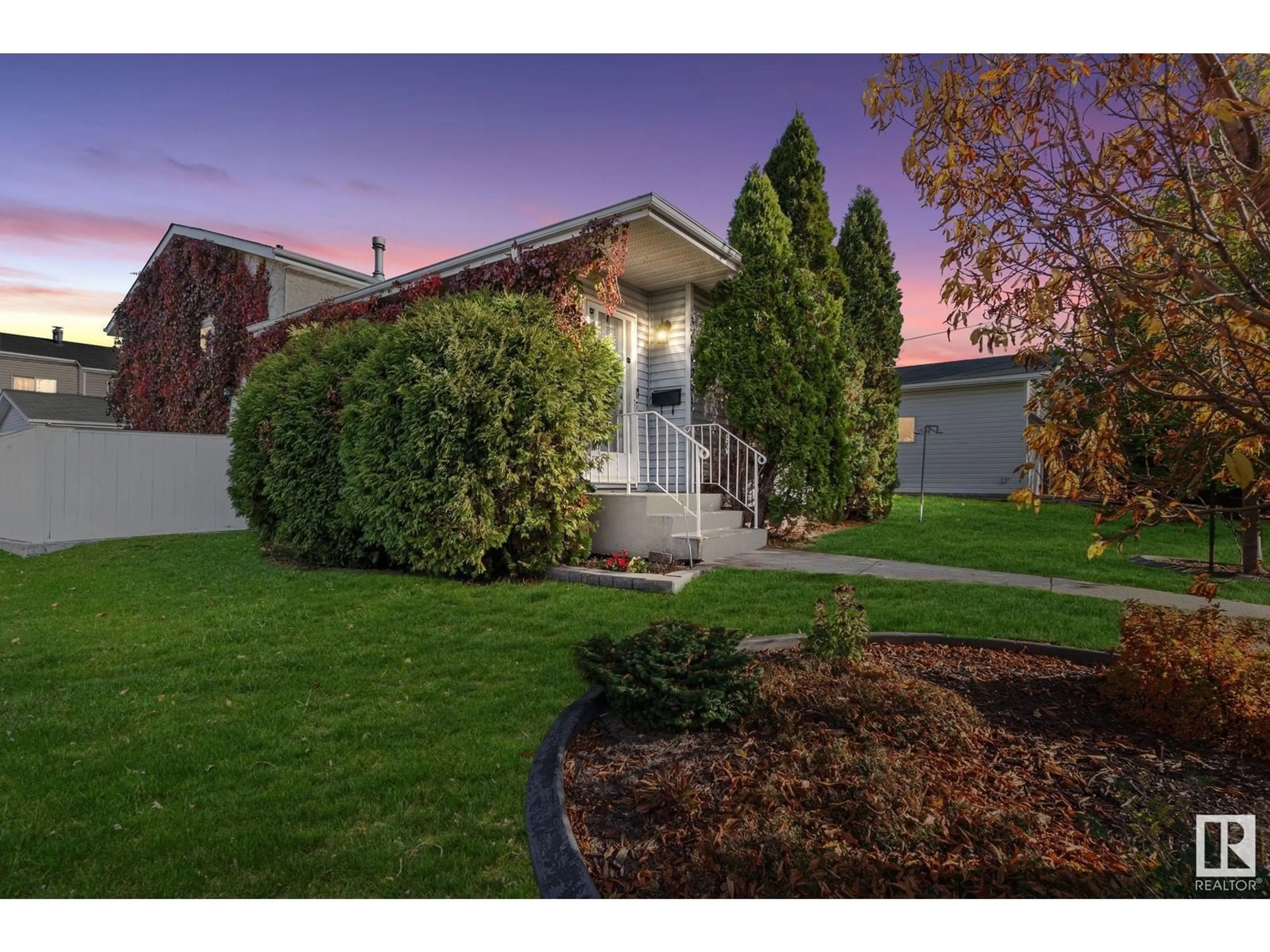 Frontside or backside of a home, the fenced backyard for 3740 25 AV NW, Edmonton Alberta T6L4M4