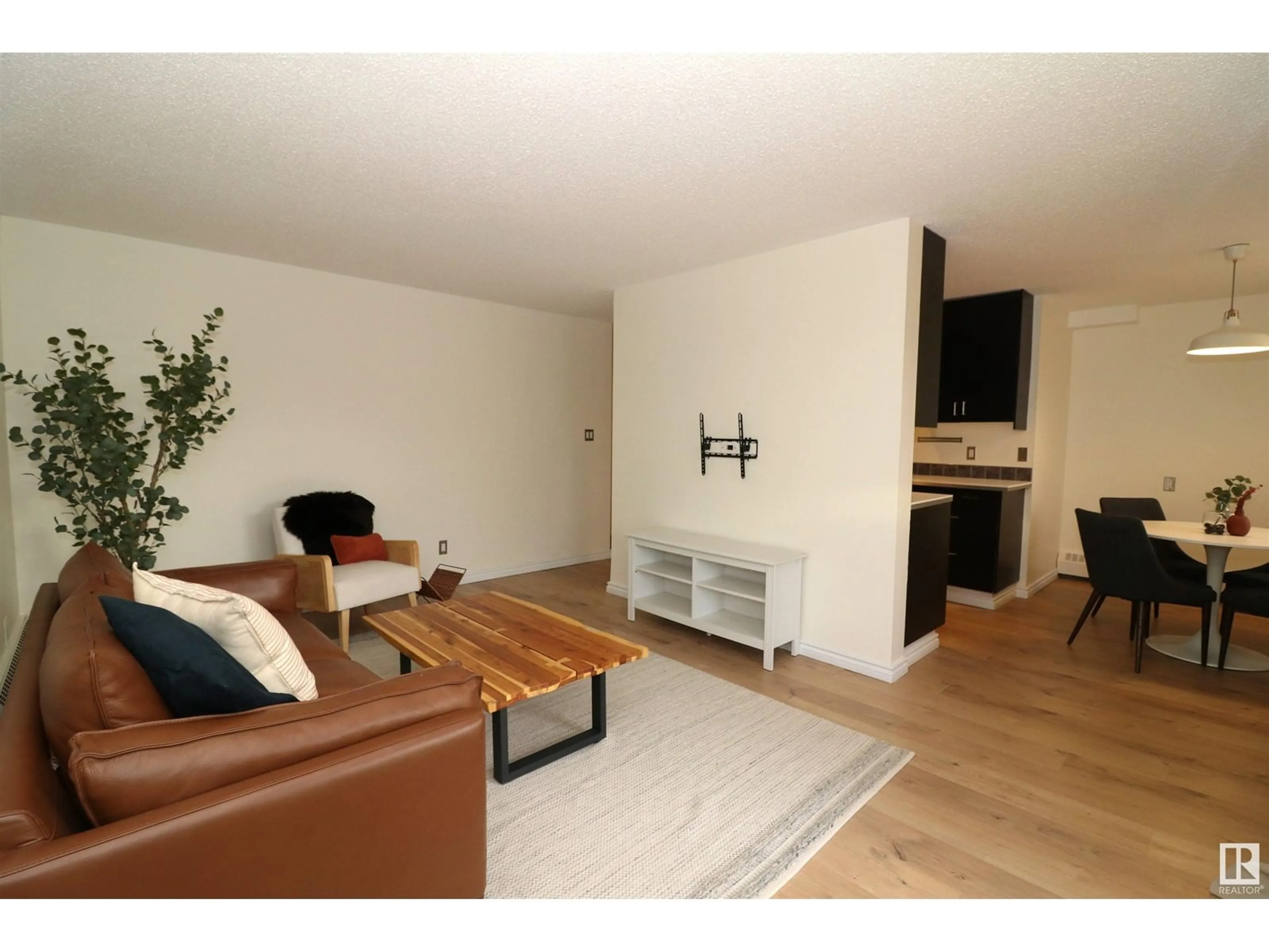 Living room, wood floors for #105 8814 95 AV NW, Edmonton Alberta T6C1Z1