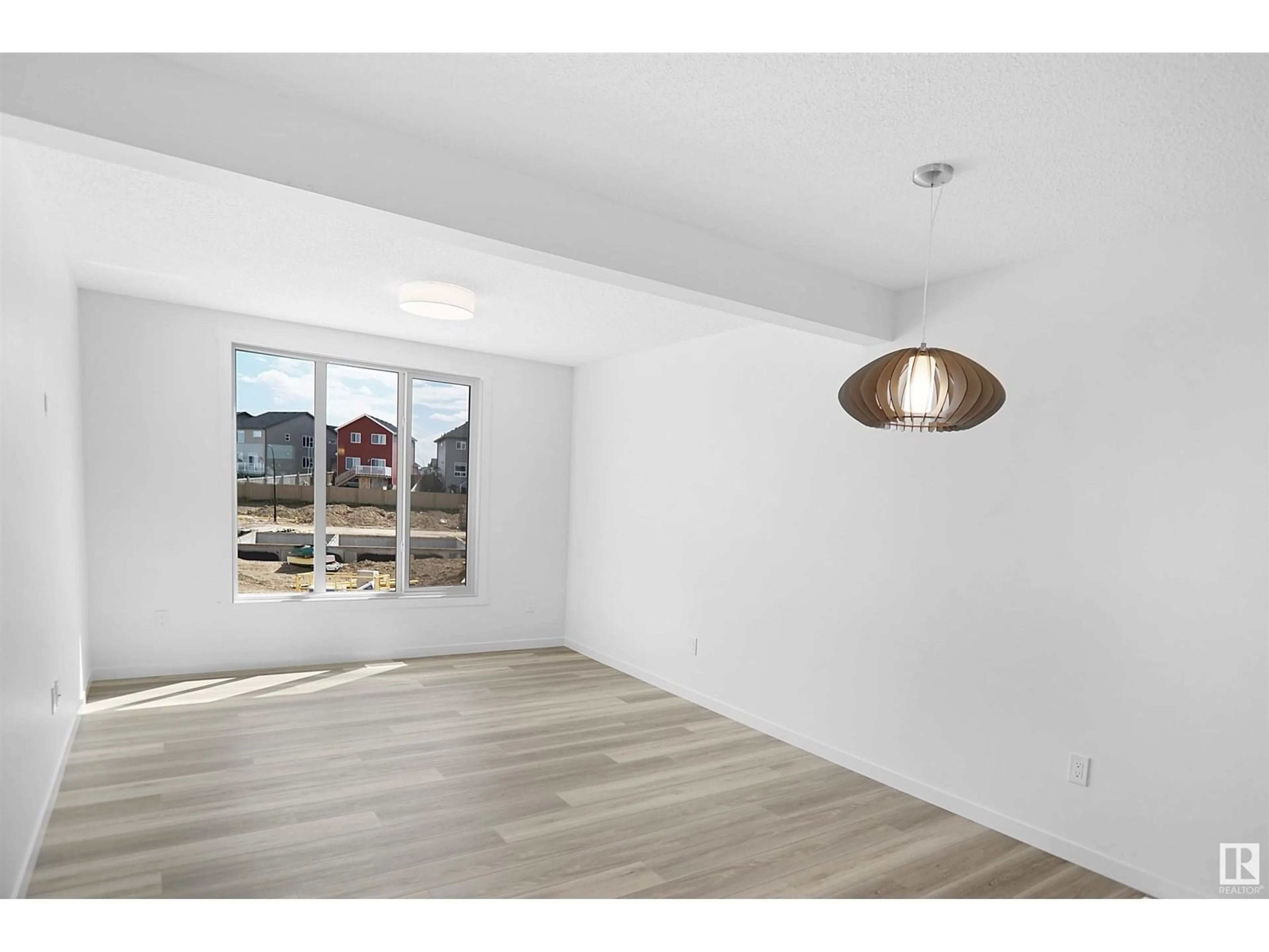 A pic of a room, wood floors for #46 1025 Secord PM NW, Edmonton Alberta T5T4A4