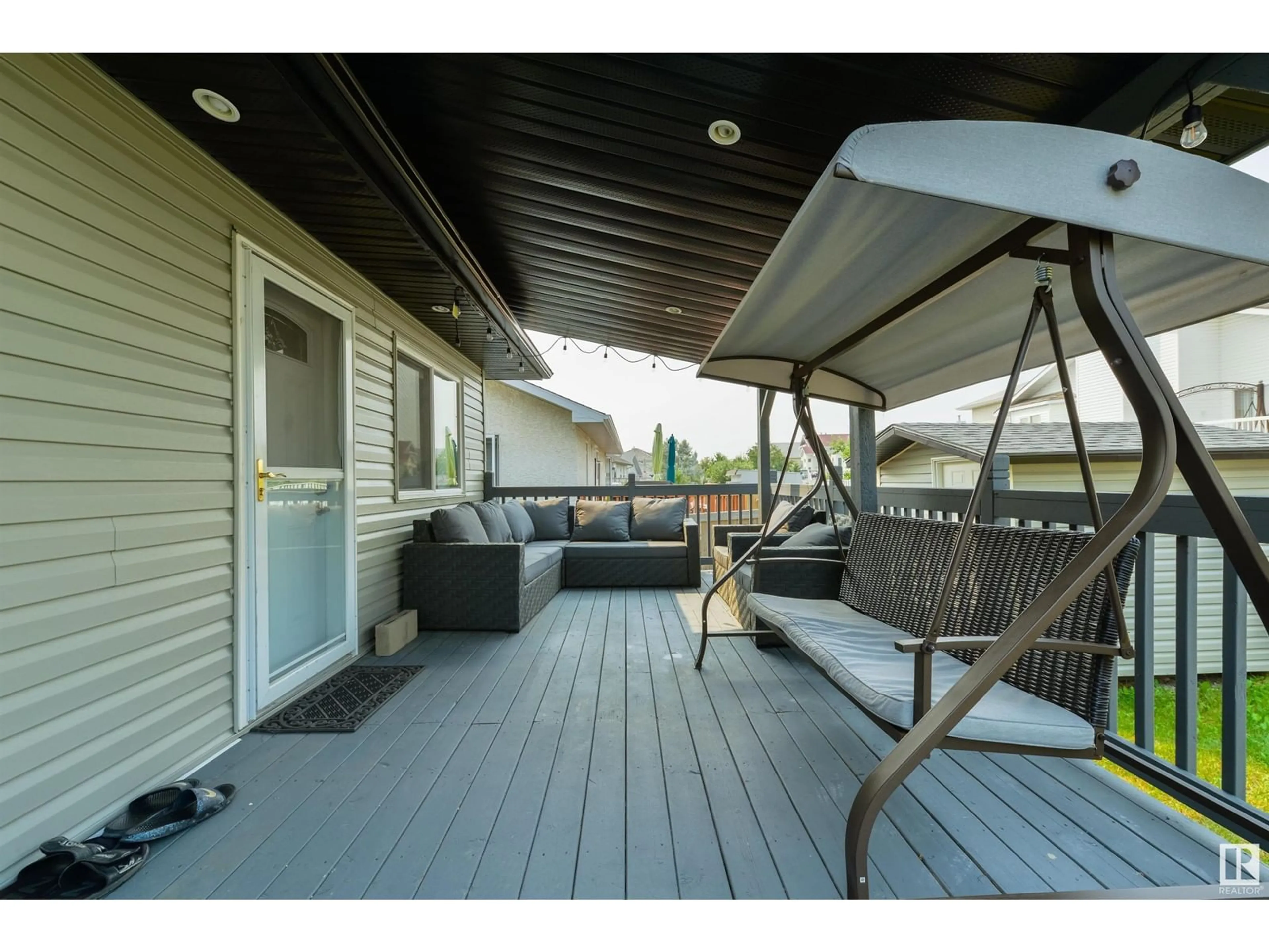 Patio, the fenced backyard for 417 HOLLICK-KENYON RD NW, Edmonton Alberta T5Y2T9