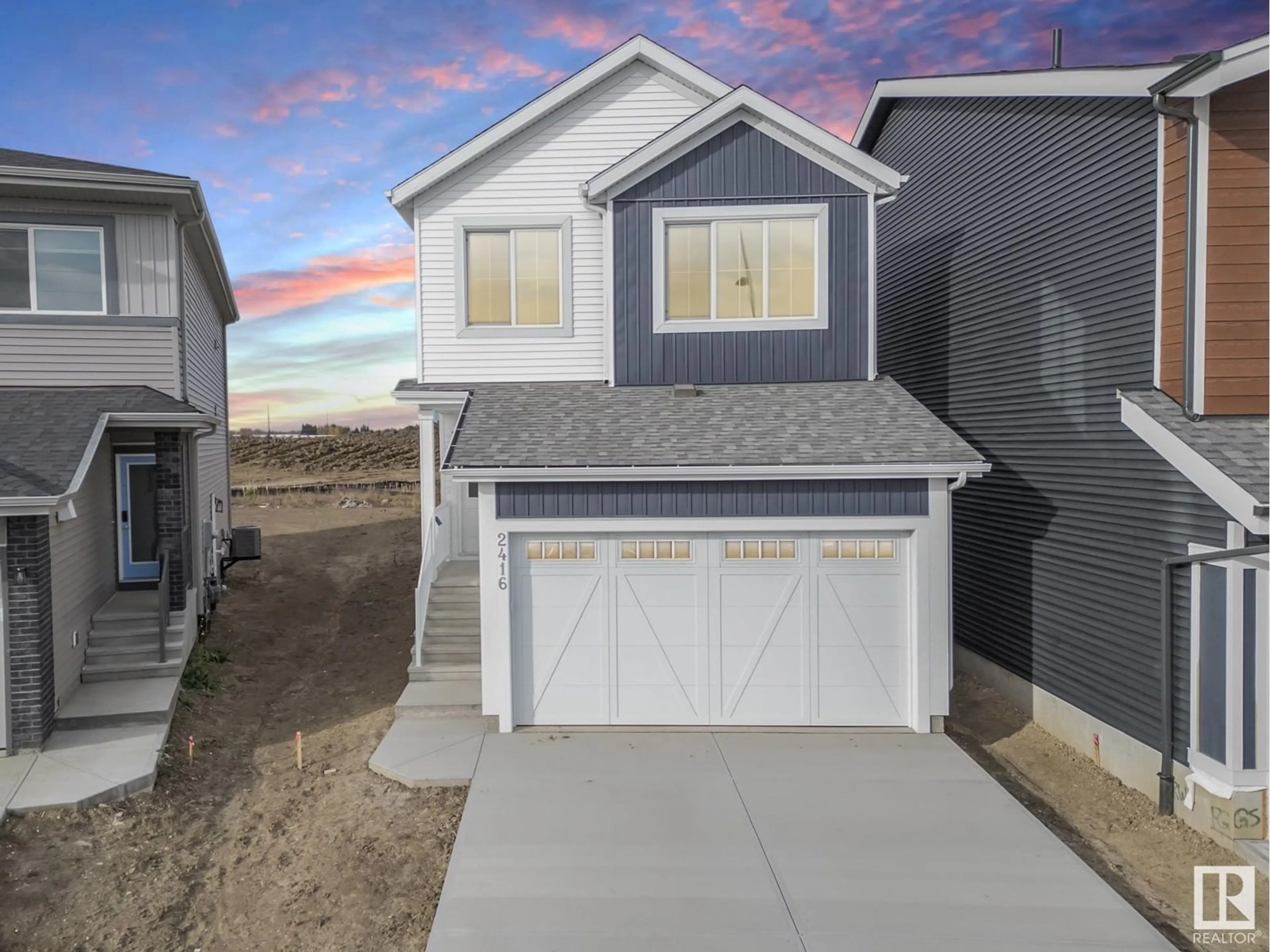 Frontside or backside of a home, the fenced backyard for 2416 208 ST NW, Edmonton Alberta T6M2J7