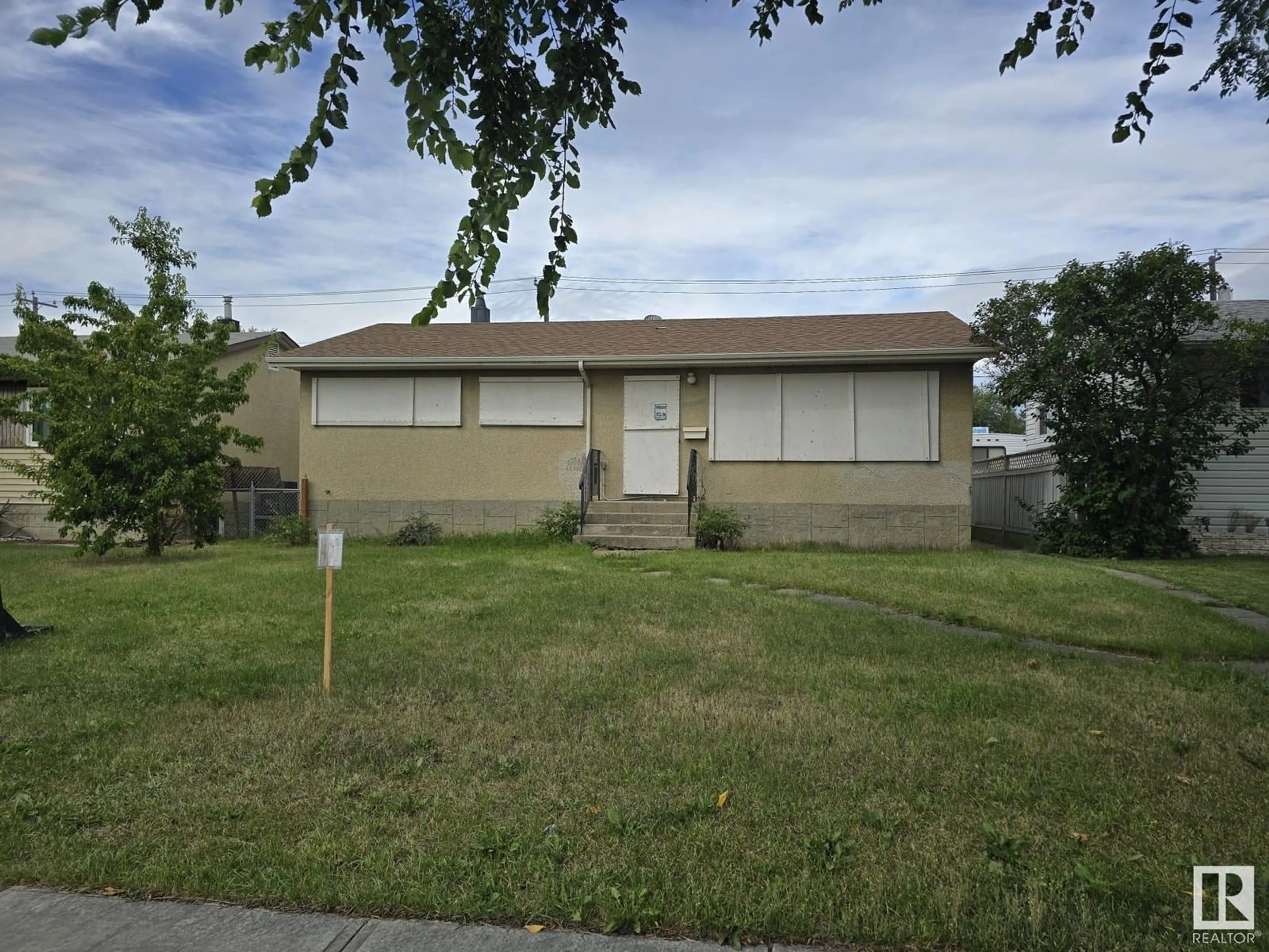 Frontside or backside of a home, the fenced backyard for 7504 75 ST NW NW, Edmonton Alberta T6C2E8