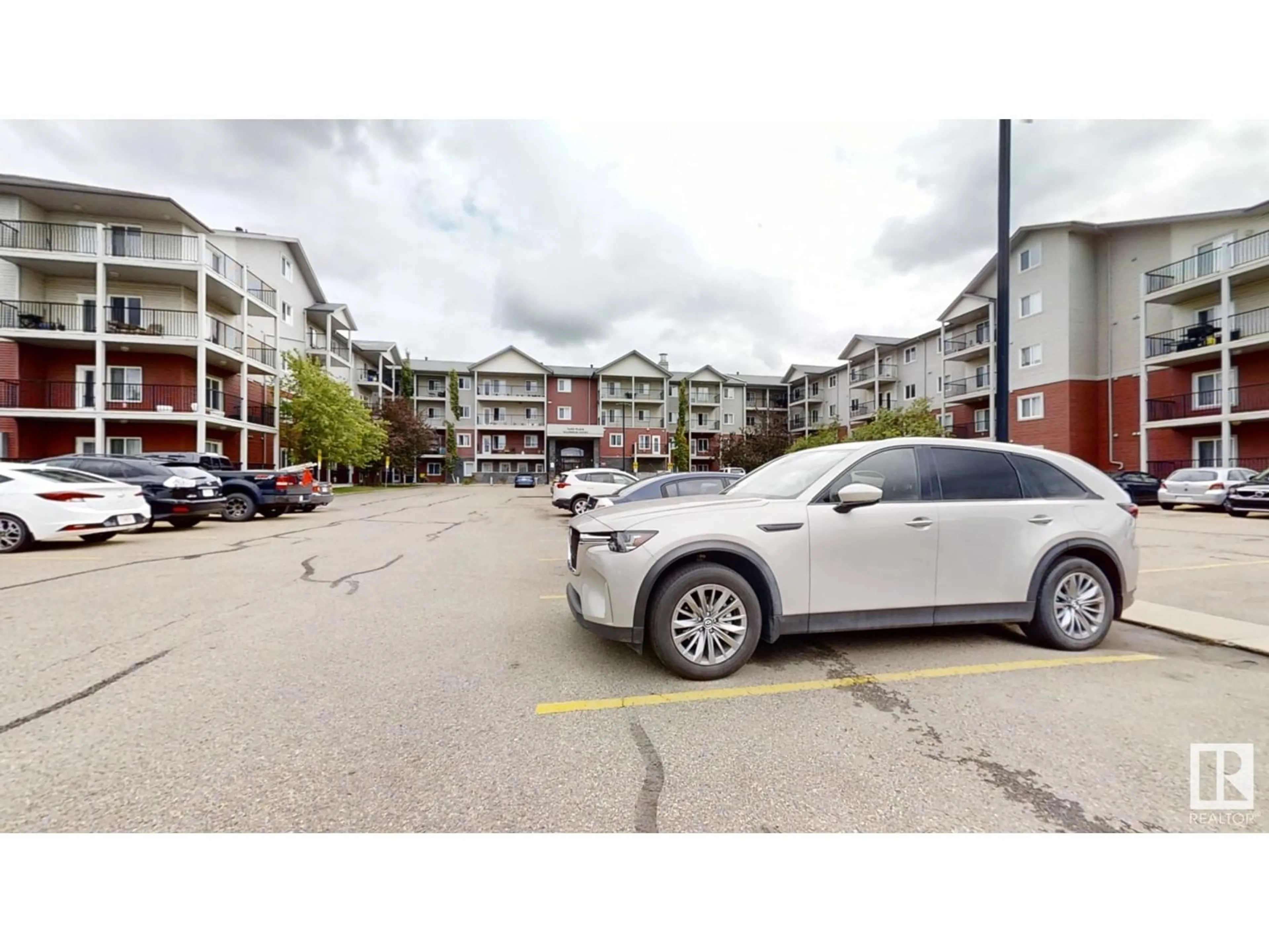 A pic from exterior of the house or condo, the street view for #425 111 Edwards DR SW, Edmonton Alberta T6X0C4