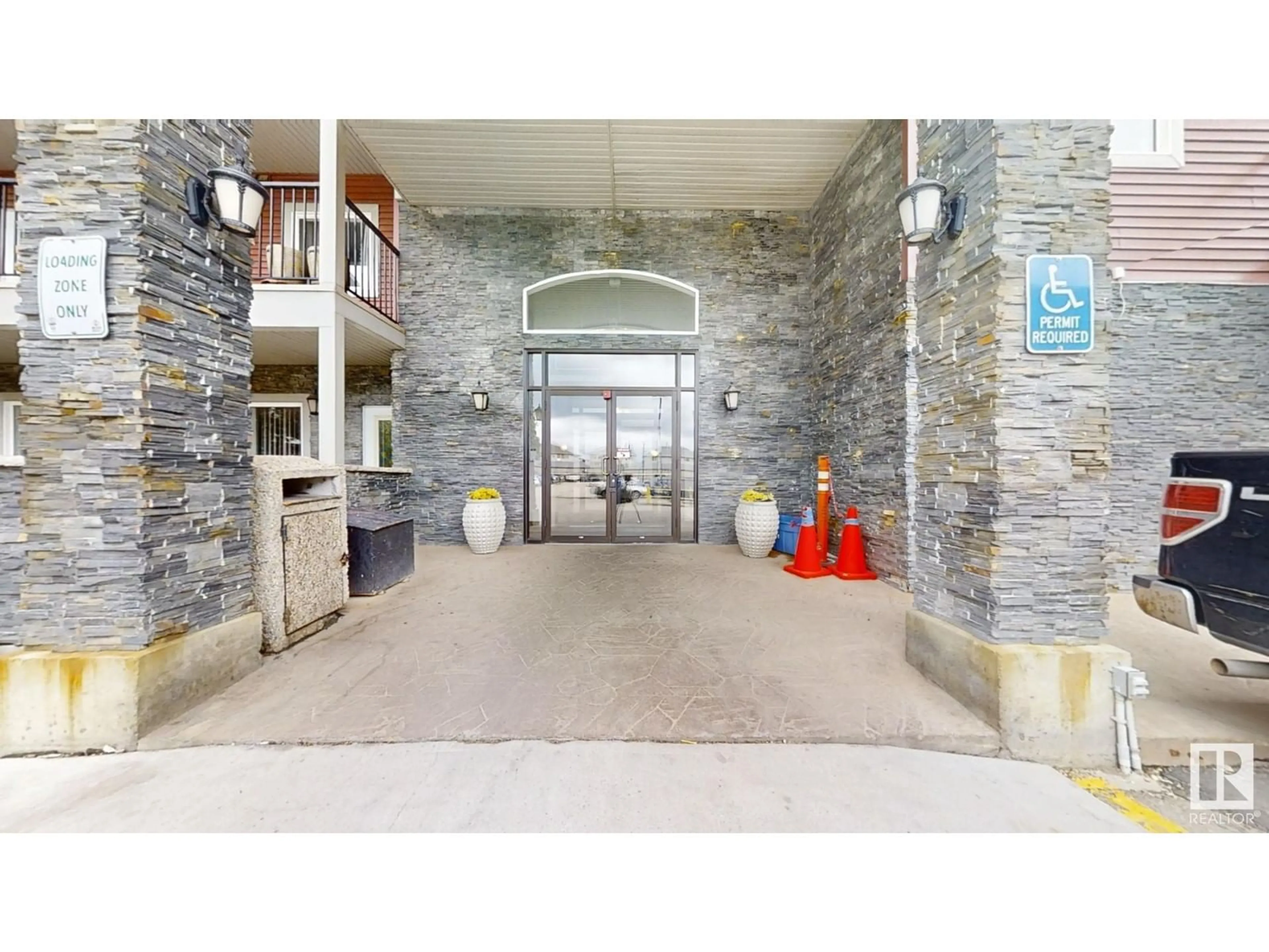 Indoor foyer, cement floor for #425 111 Edwards DR SW, Edmonton Alberta T6X0C4