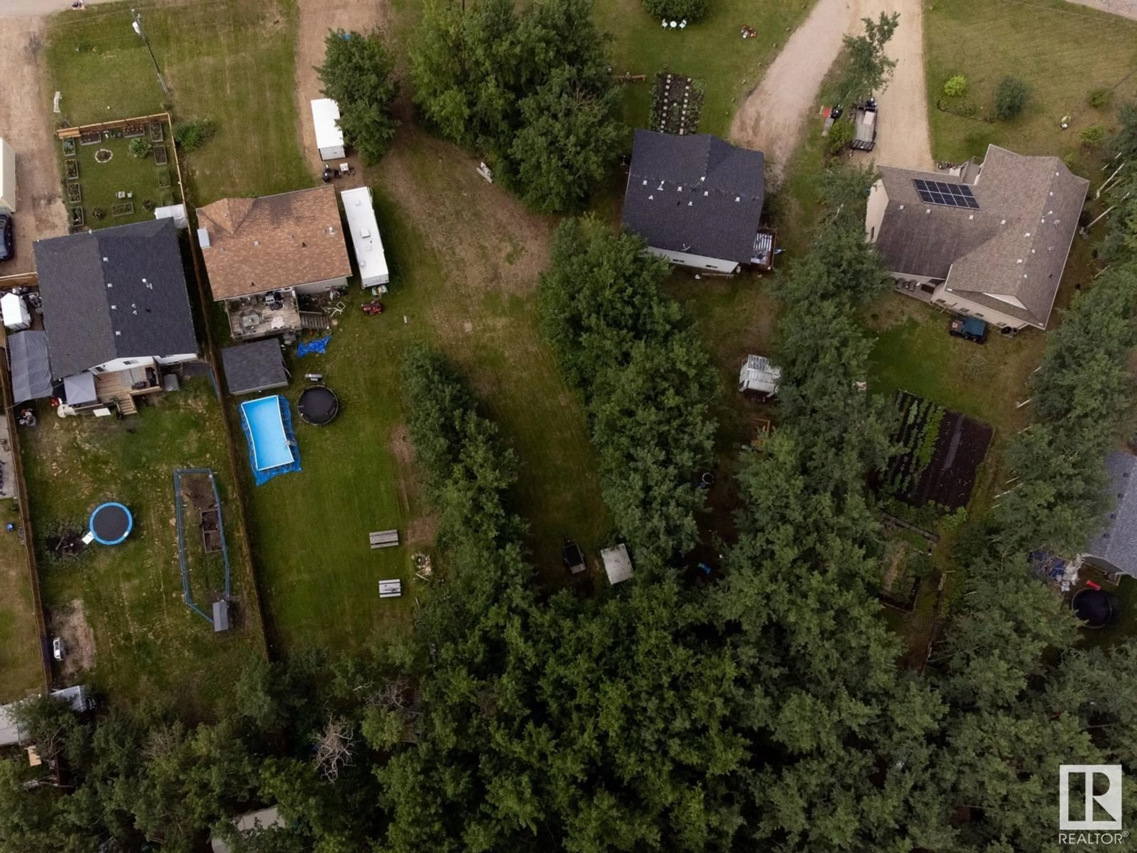 Frontside or backside of a home, the fenced backyard for #186 51551 Rge Rd 212A, Rural Strathcona County Alberta T8G1B2