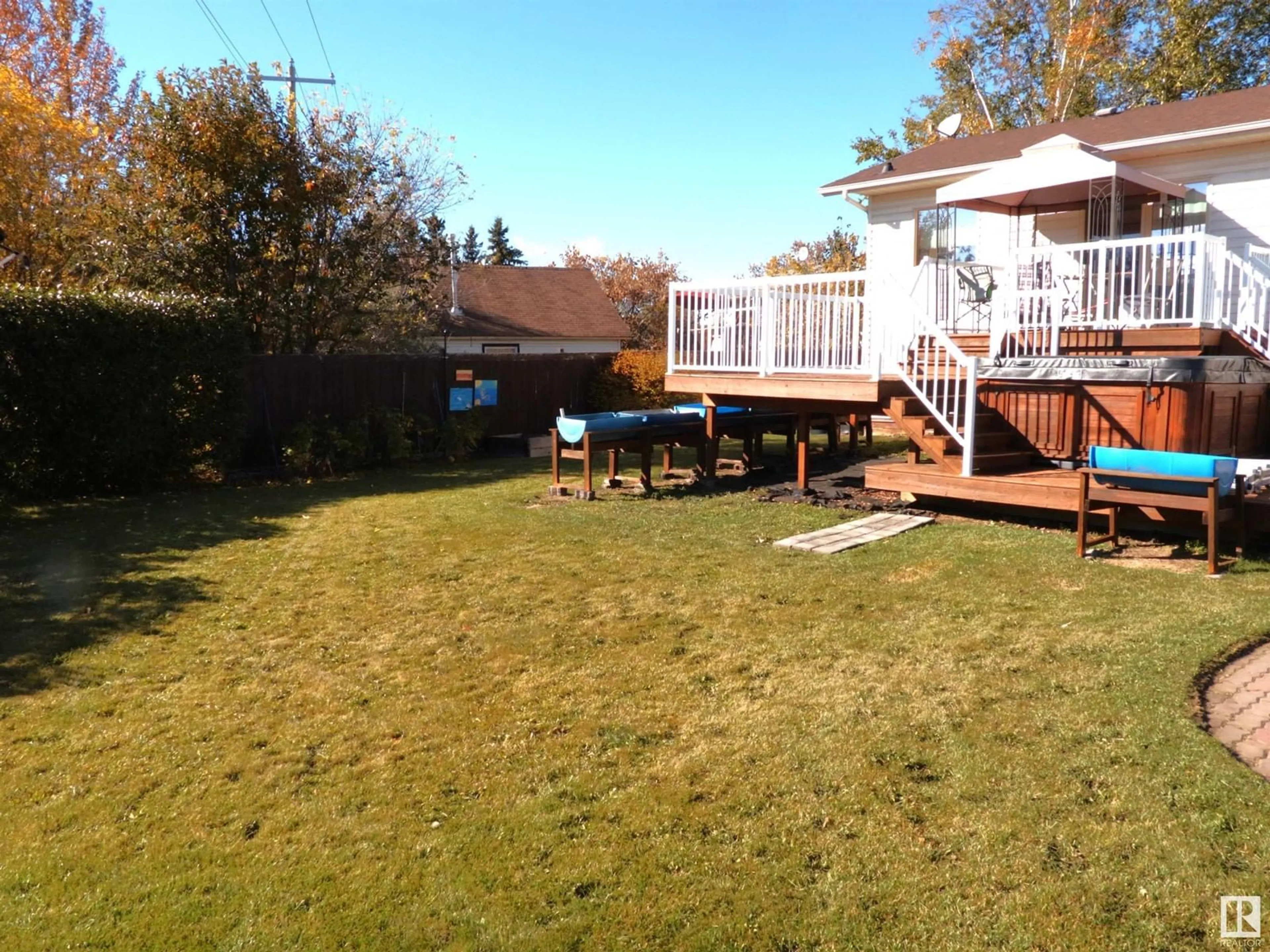 Frontside or backside of a home, the fenced backyard for 5215 49 AV, Onoway Alberta T0E1V0