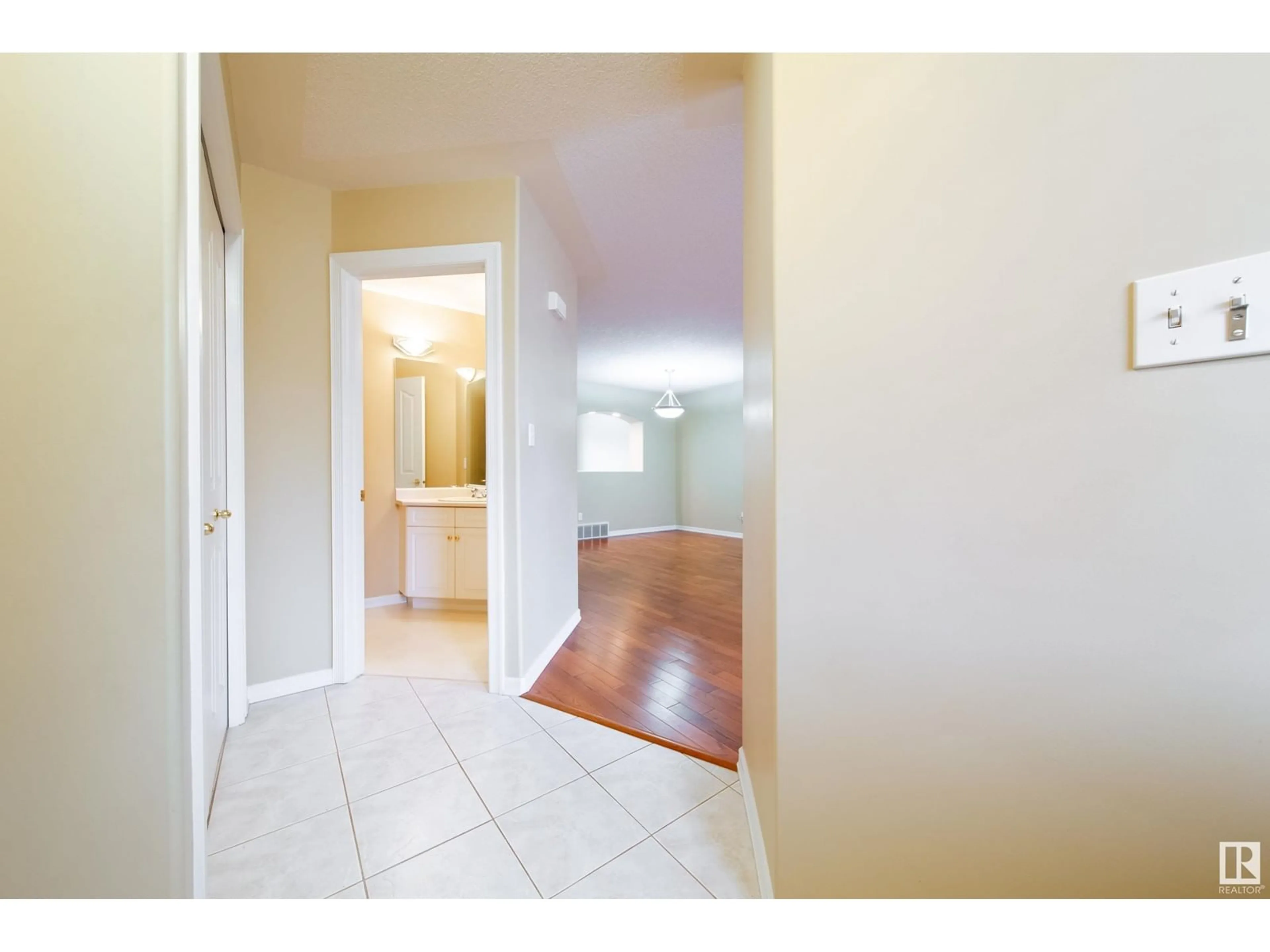 Indoor entryway, wood floors for #21 2419 133 AV NW, Edmonton Alberta T5A5A5