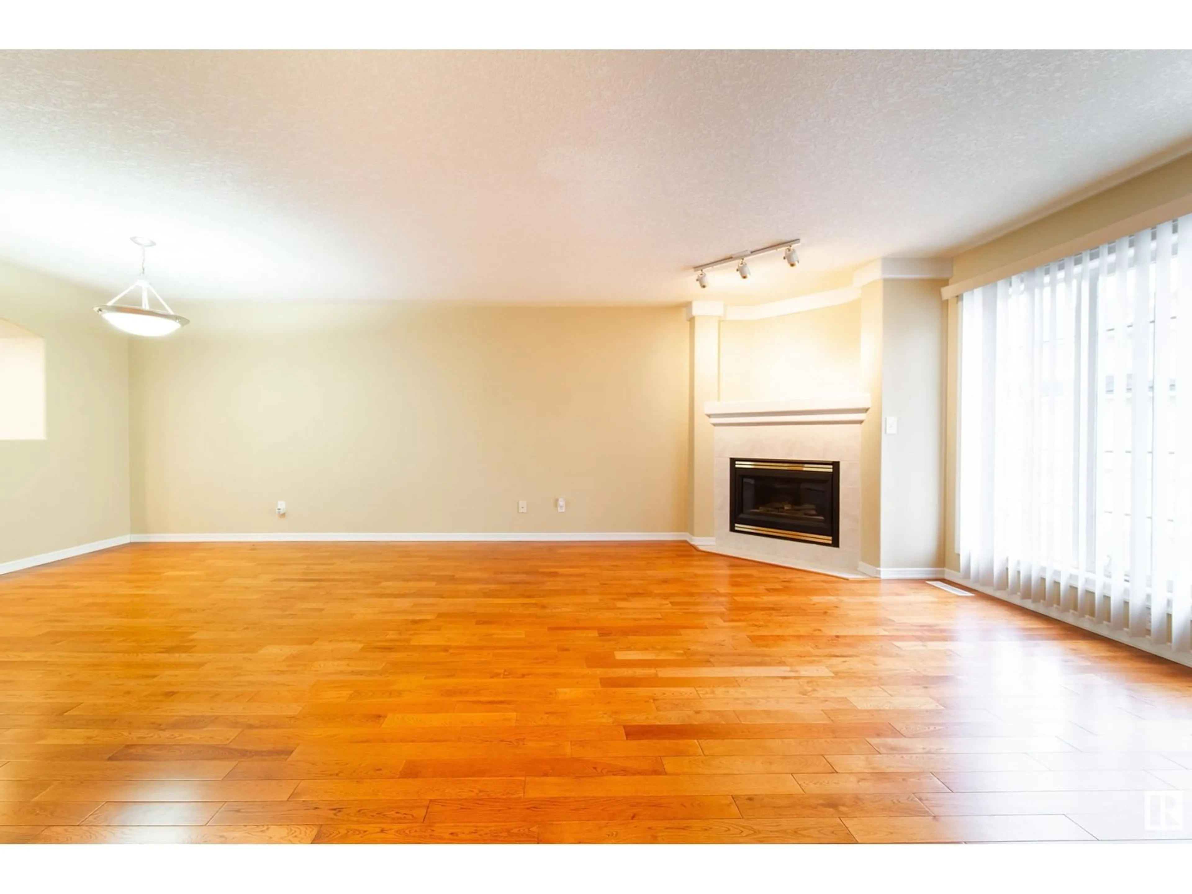 A pic of a room, wood floors for #21 2419 133 AV NW, Edmonton Alberta T5A5A5