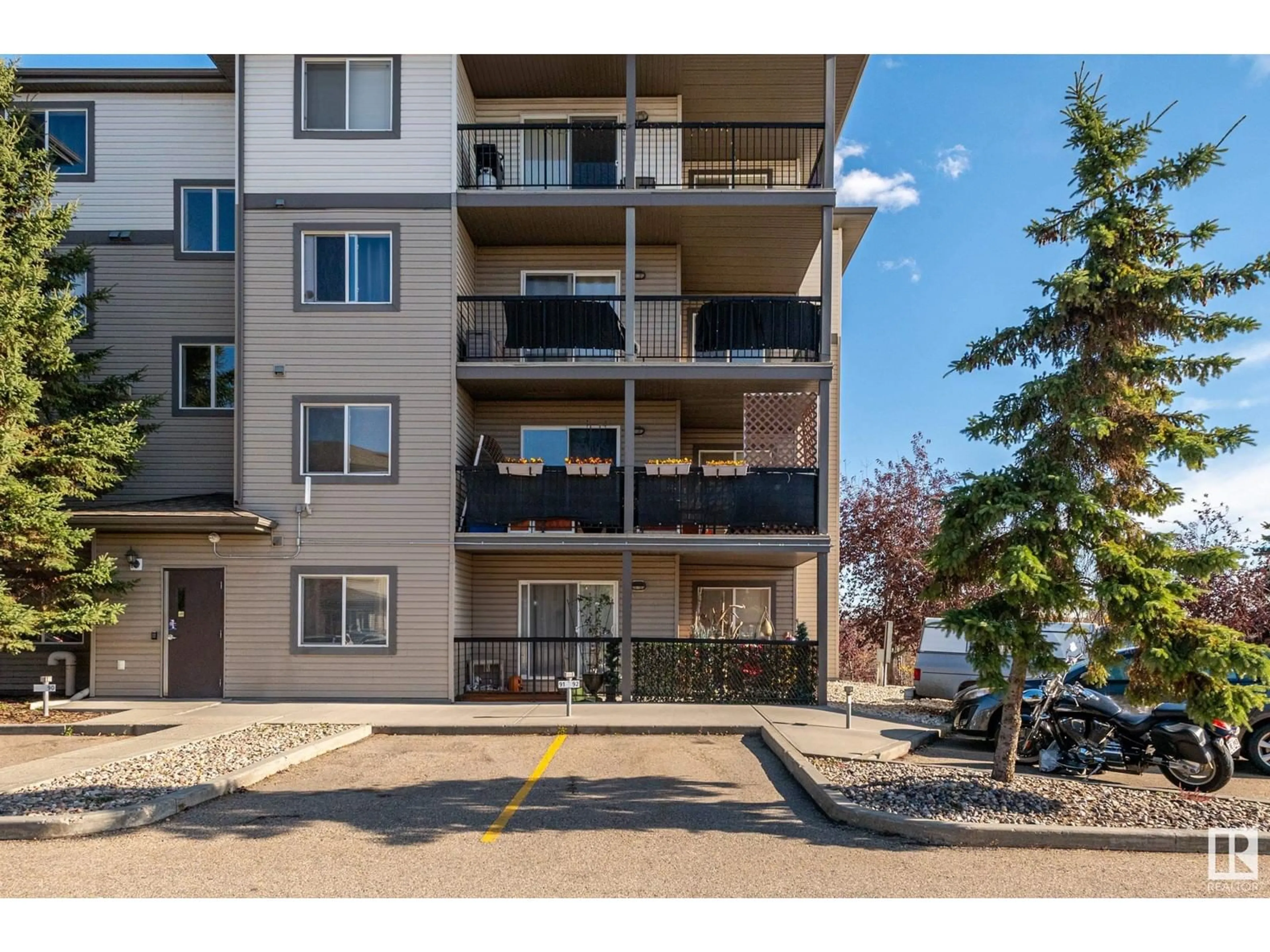 A pic from exterior of the house or condo, the street view for #116 1188 HYNDMAN RD NW, Edmonton Alberta T5A0E9