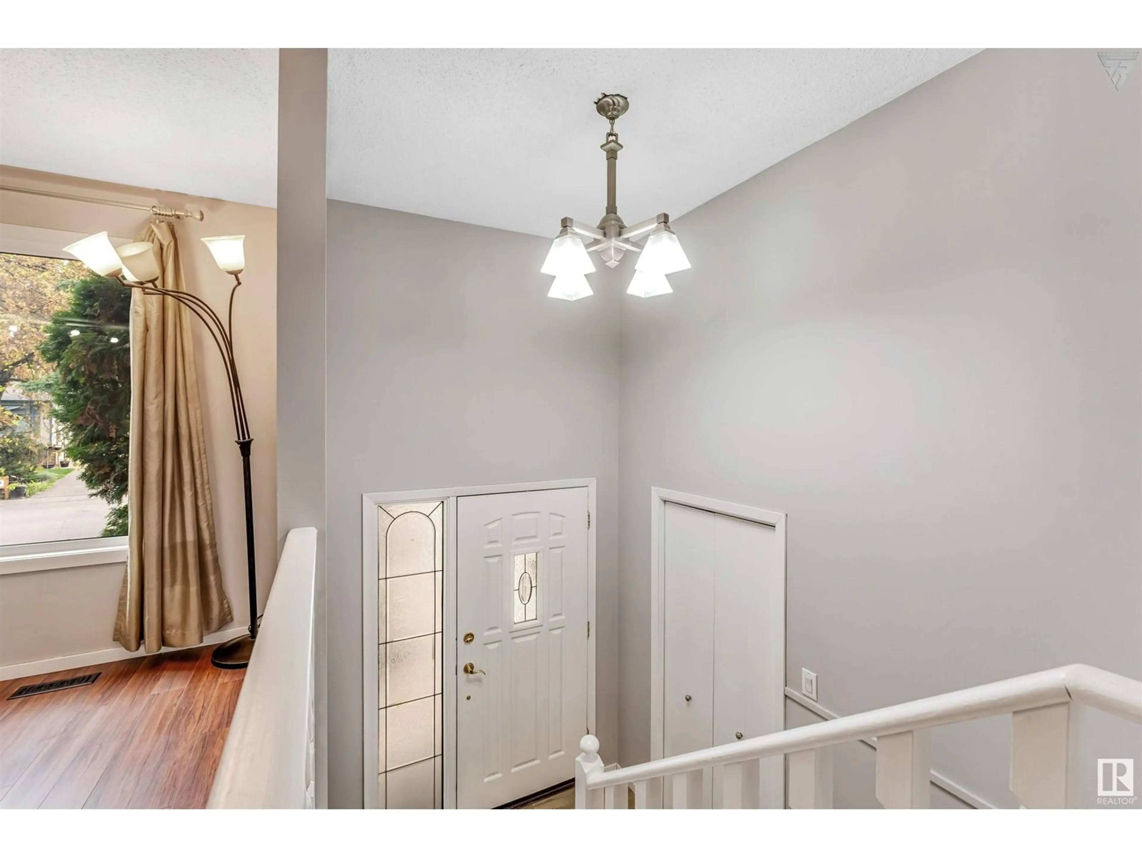 Indoor entryway, wood floors for 6416 11 AV NW, Edmonton Alberta T6L2G4