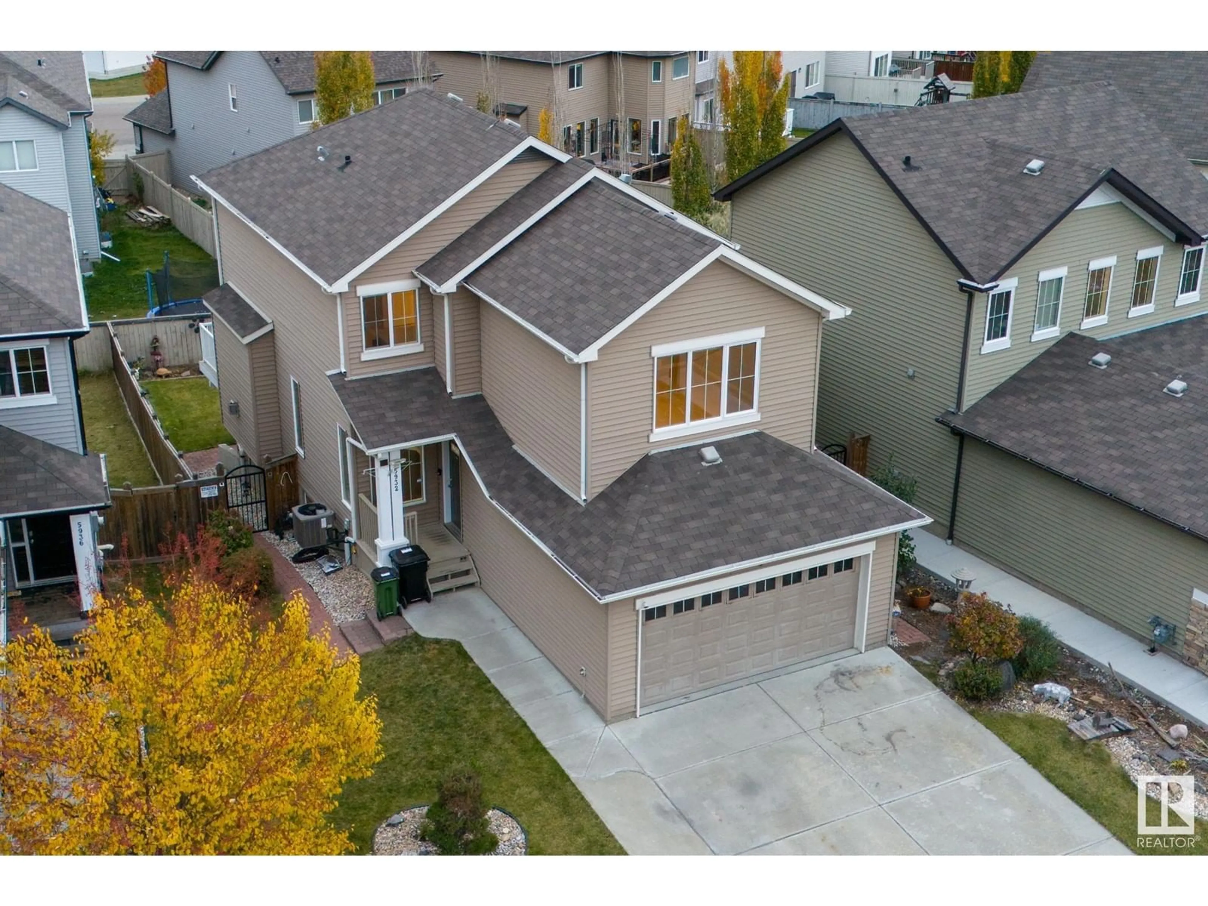 Frontside or backside of a home, the street view for 5932 12 AV SW, Edmonton Alberta T6X0M7