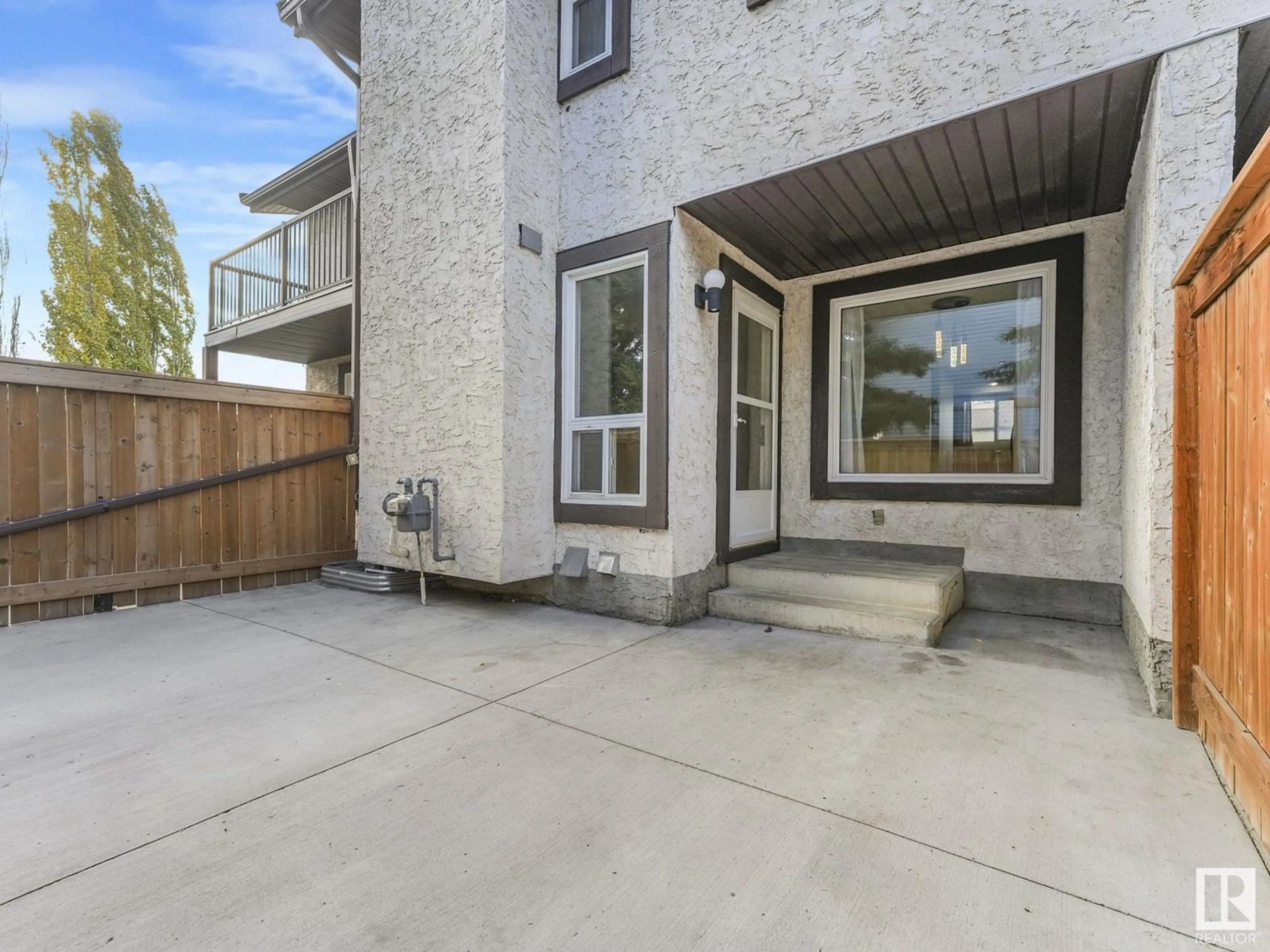 Frontside or backside of a home, the fenced backyard for 2914 36 ST NW, Edmonton Alberta T6L5H4