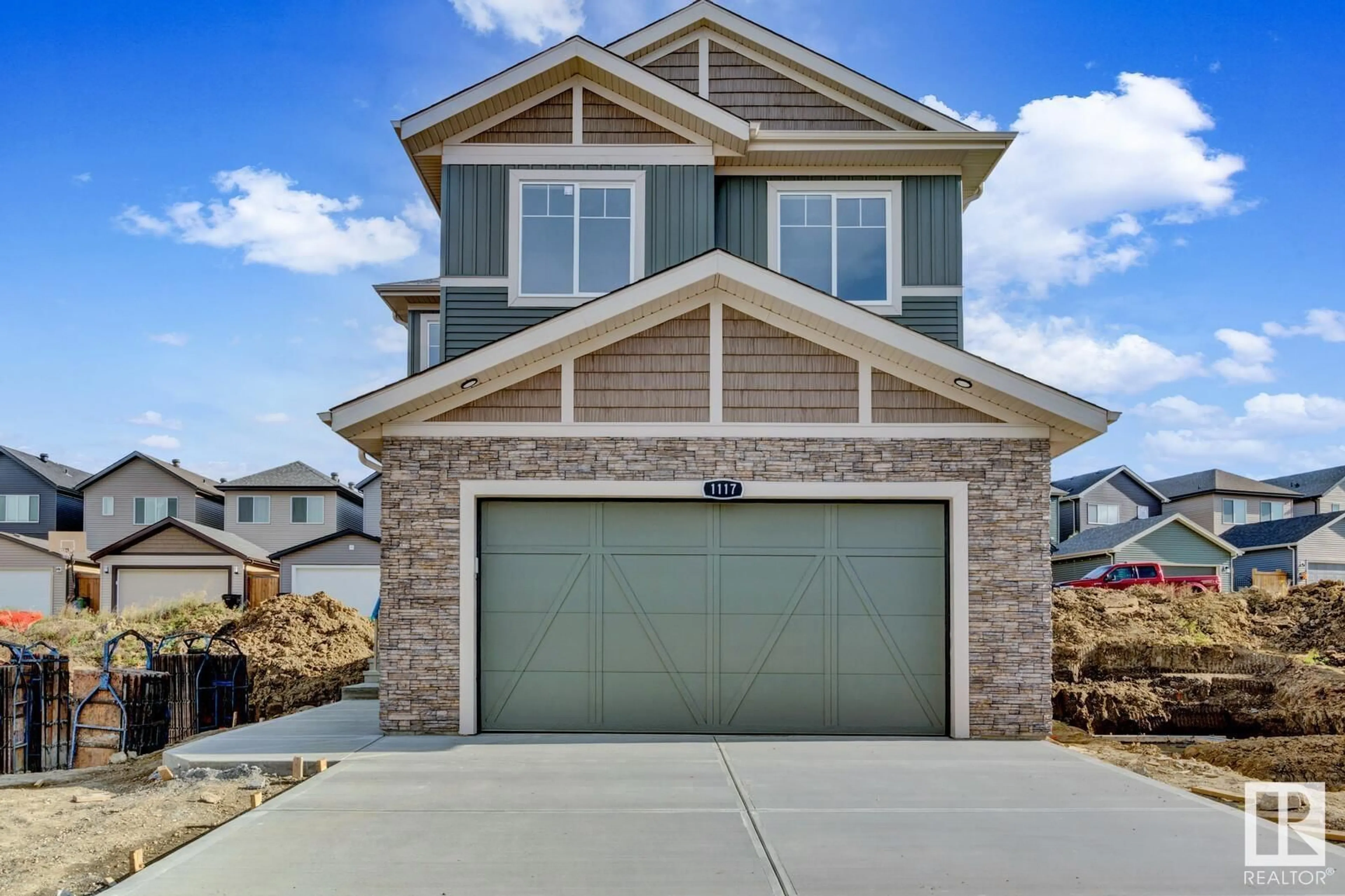 Frontside or backside of a home, the street view for 1117 GYRFALCON CR NW, Edmonton Alberta T5S0S5