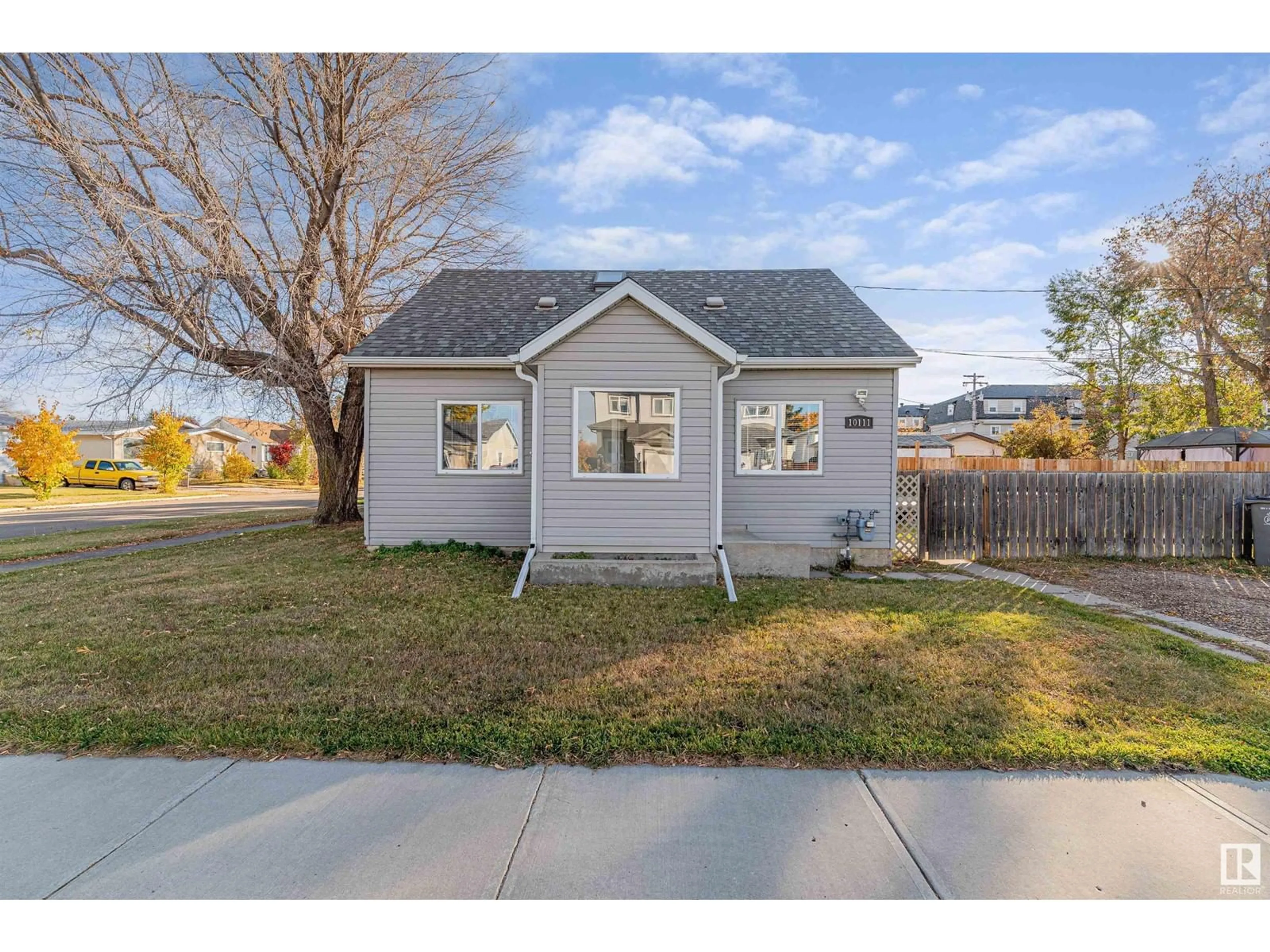 Frontside or backside of a home, the fenced backyard for 10111 103 ST, Morinville Alberta T8R1N5