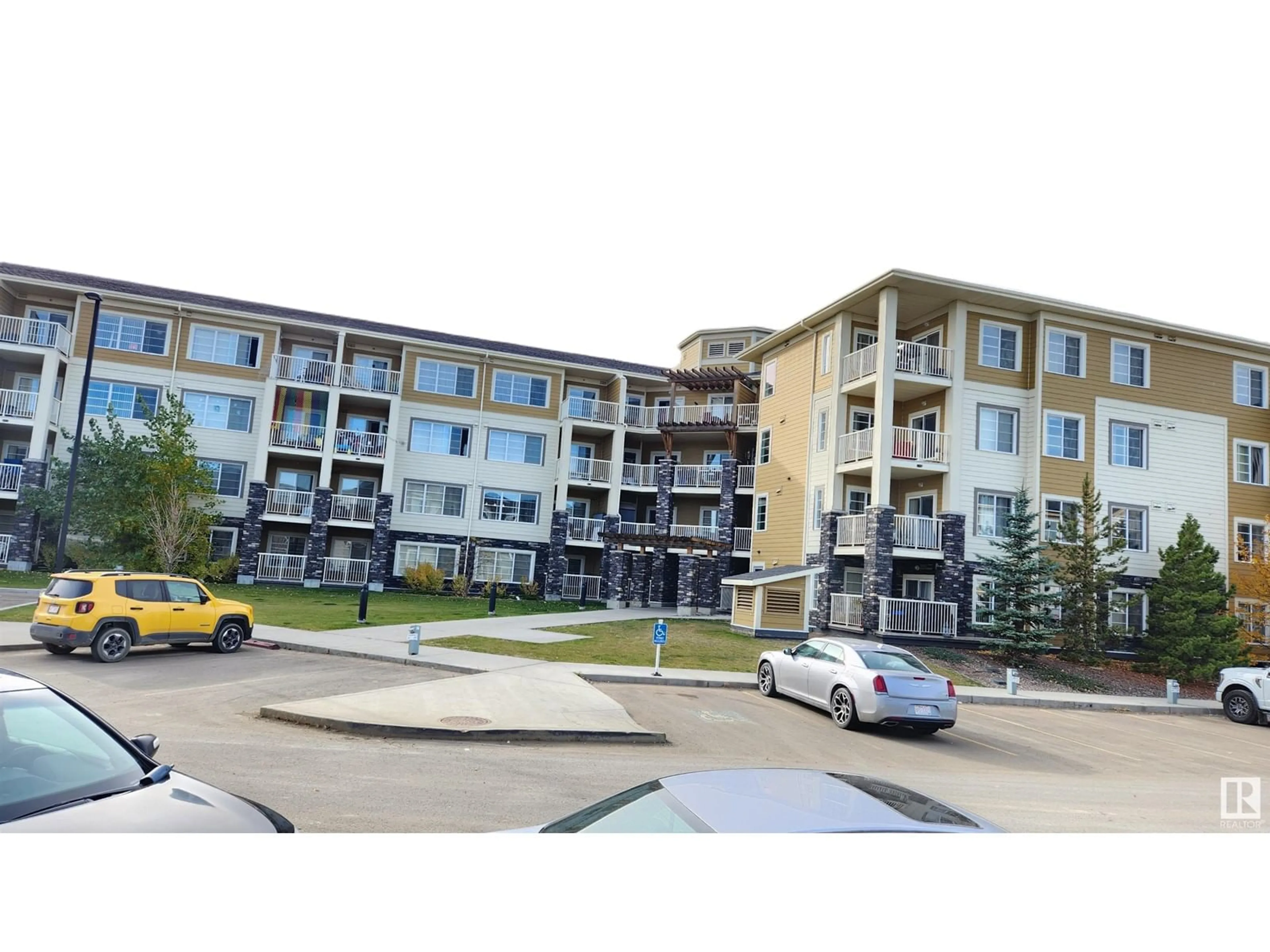 A pic from exterior of the house or condo, the street view for #216 3670 139 AV NW, Edmonton Alberta T5Y3N5