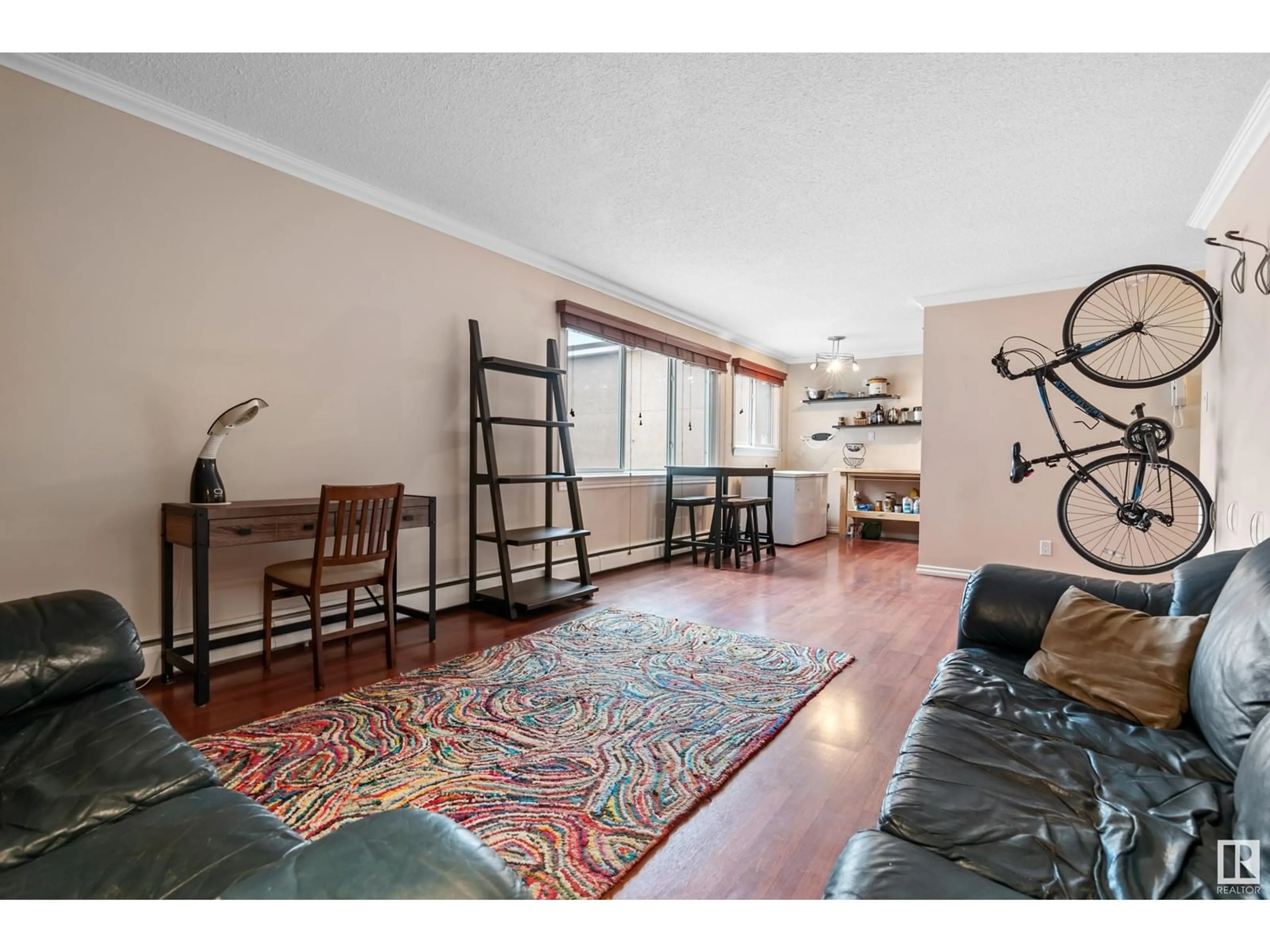 Living room, wood floors for #202 10555 83 AV NW, Edmonton Alberta T6E2E1