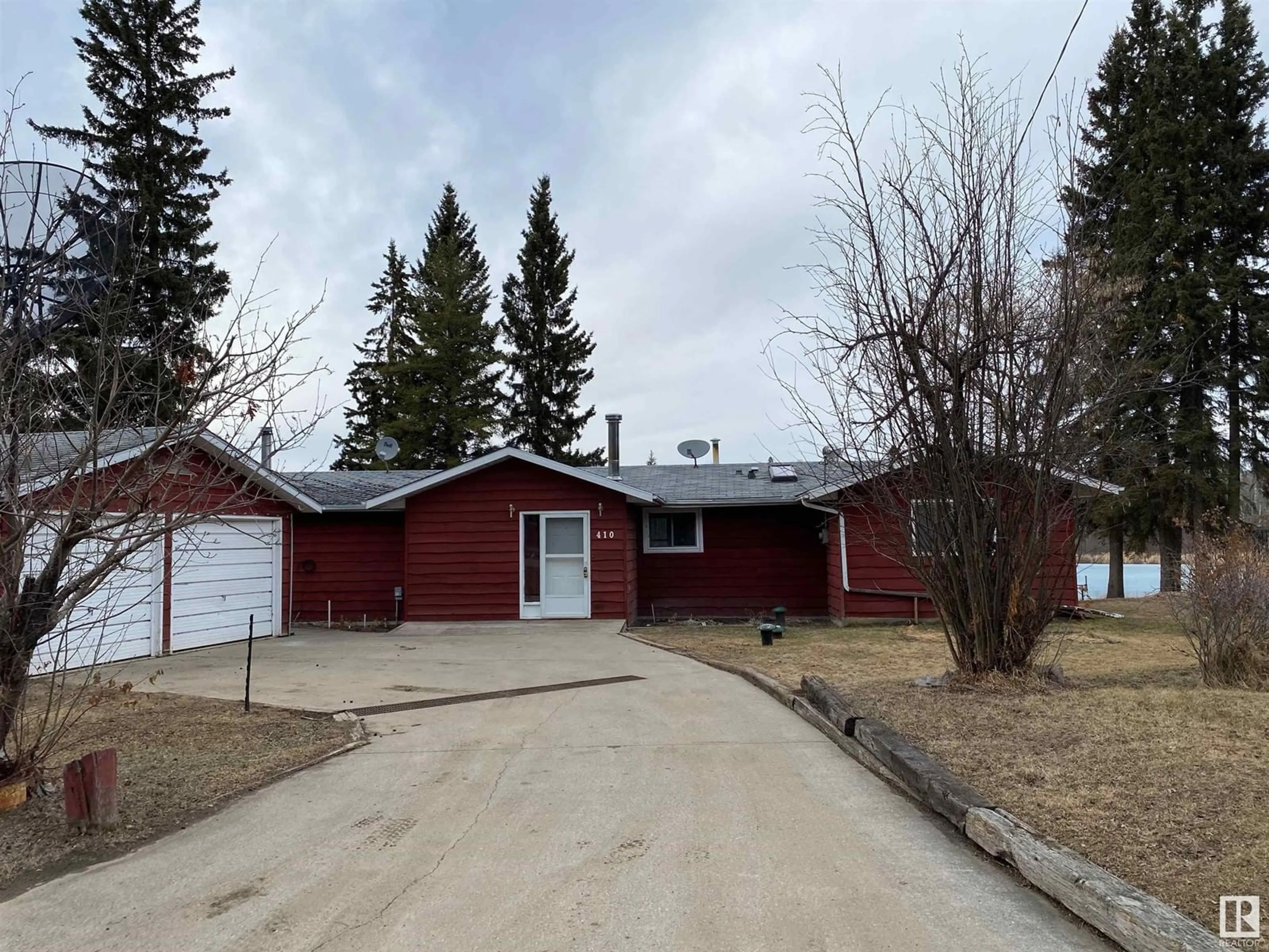 Frontside or backside of a home, the front or back of building for 410 Spruce AV, Rural Athabasca County Alberta T0A0M0