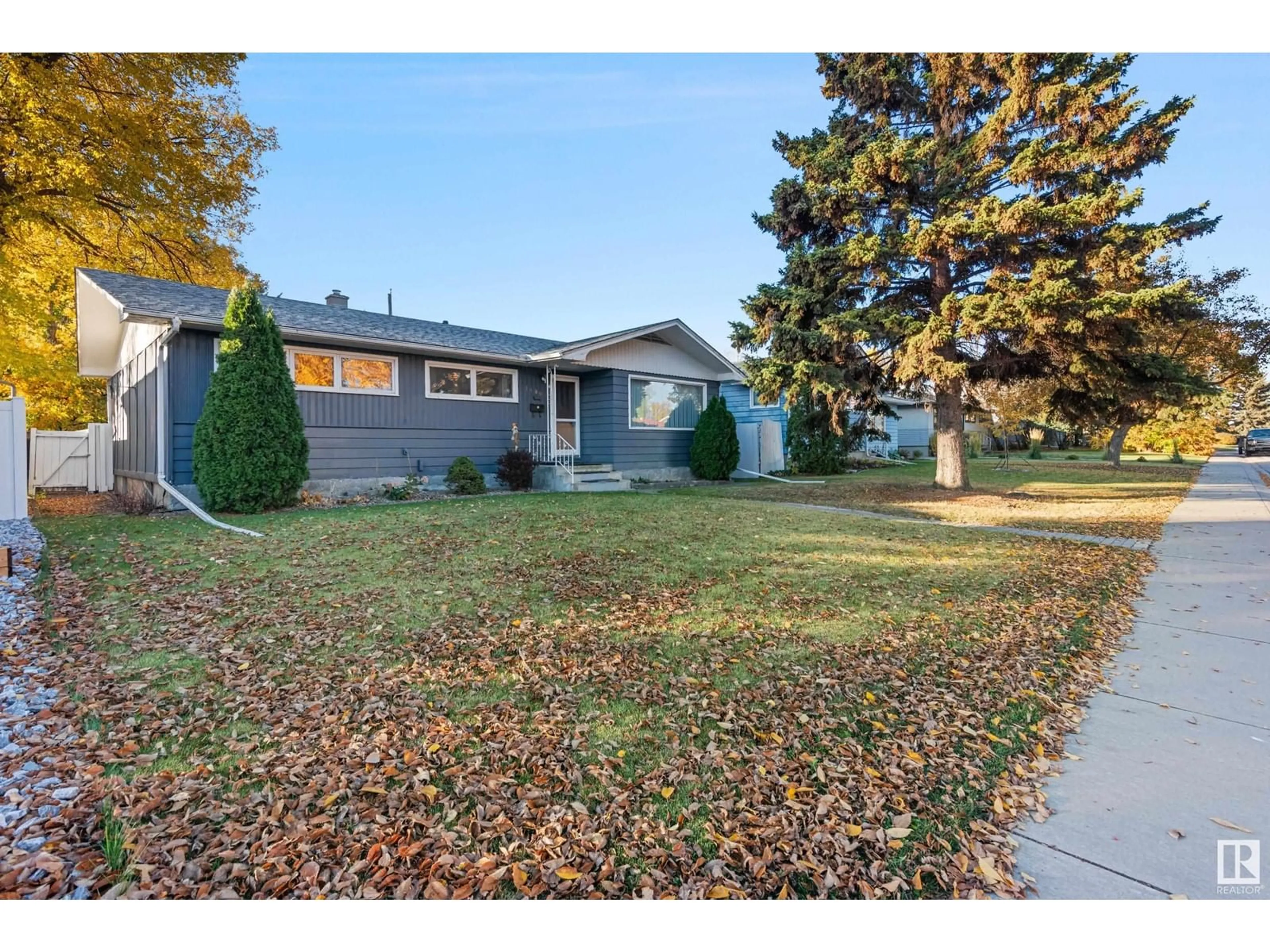 Frontside or backside of a home, the fenced backyard for 16009 94 AV NW, Edmonton Alberta T5R5L1