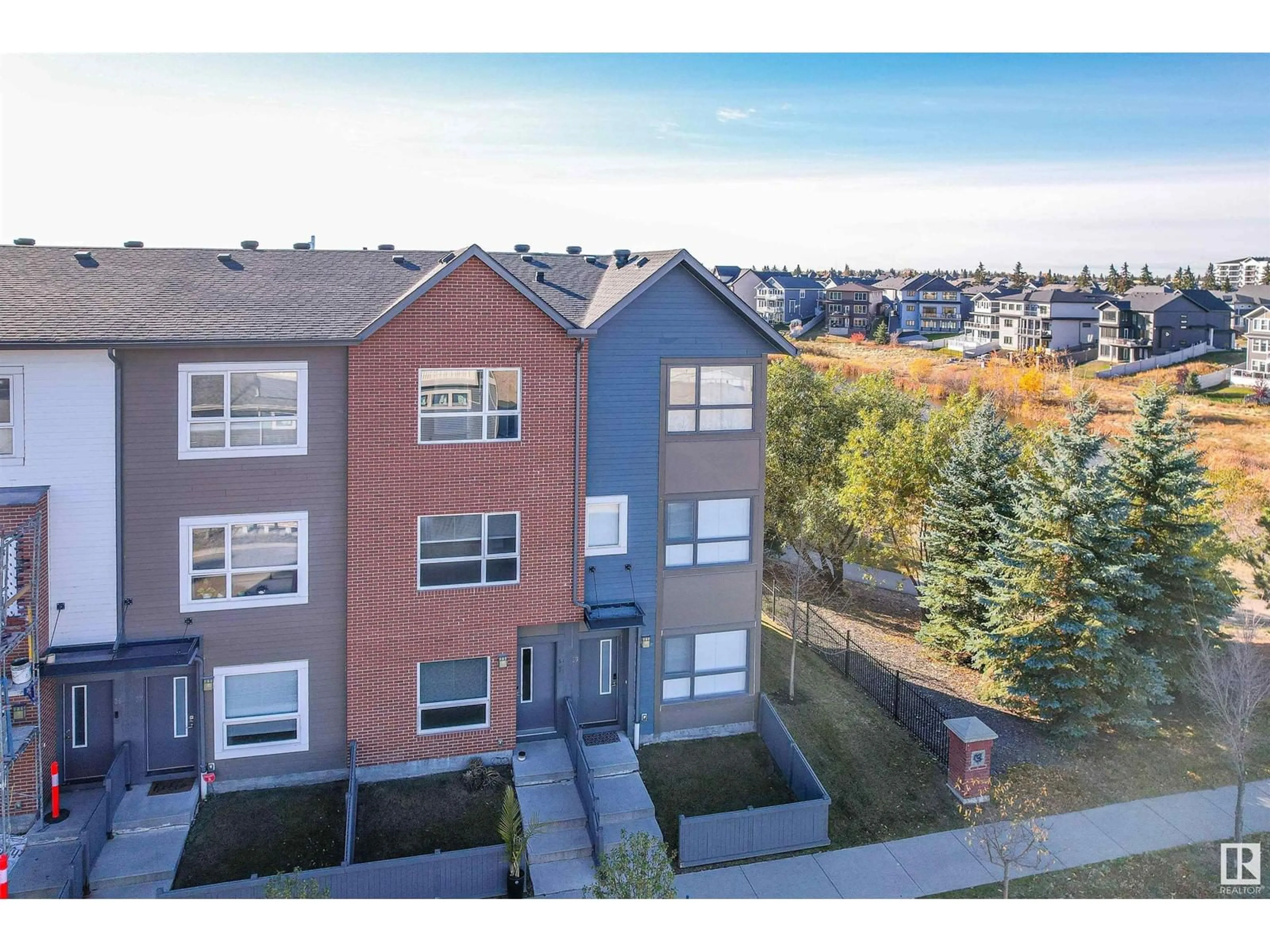 A pic from exterior of the house or condo, the fenced backyard for #38 2560 Pegasus BV NW NW, Edmonton Alberta T5E6V4