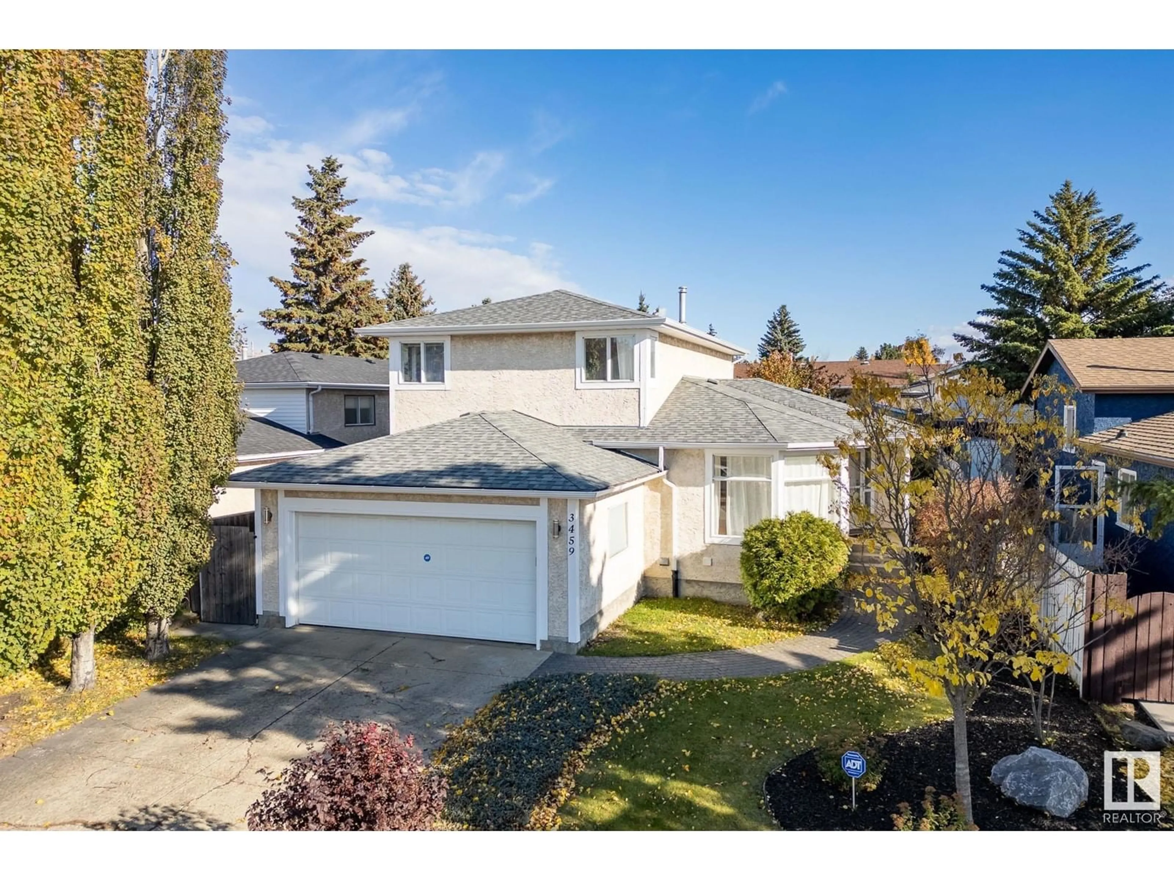 Frontside or backside of a home, the fenced backyard for 3459 40 ST NW, Edmonton Alberta T6L4S8