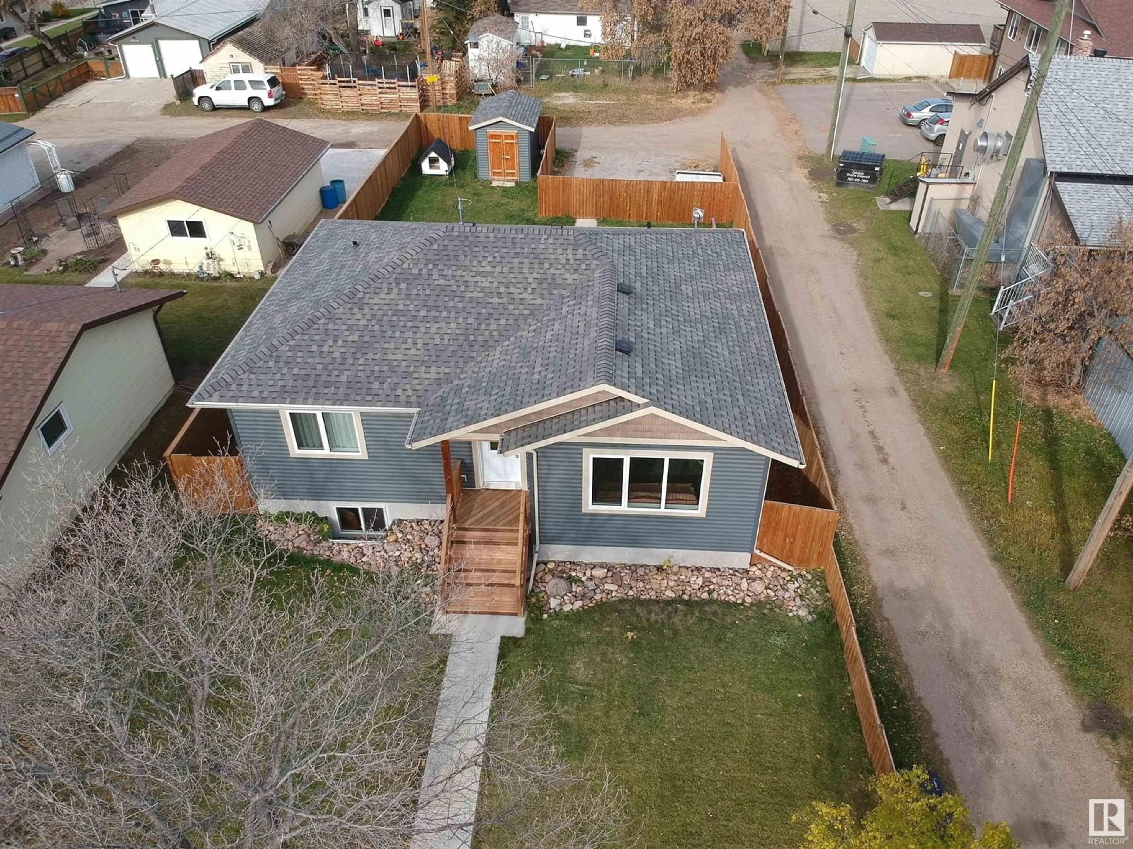 Frontside or backside of a home, the fenced backyard for 5012 48 AV, Onoway Alberta T0E1V0