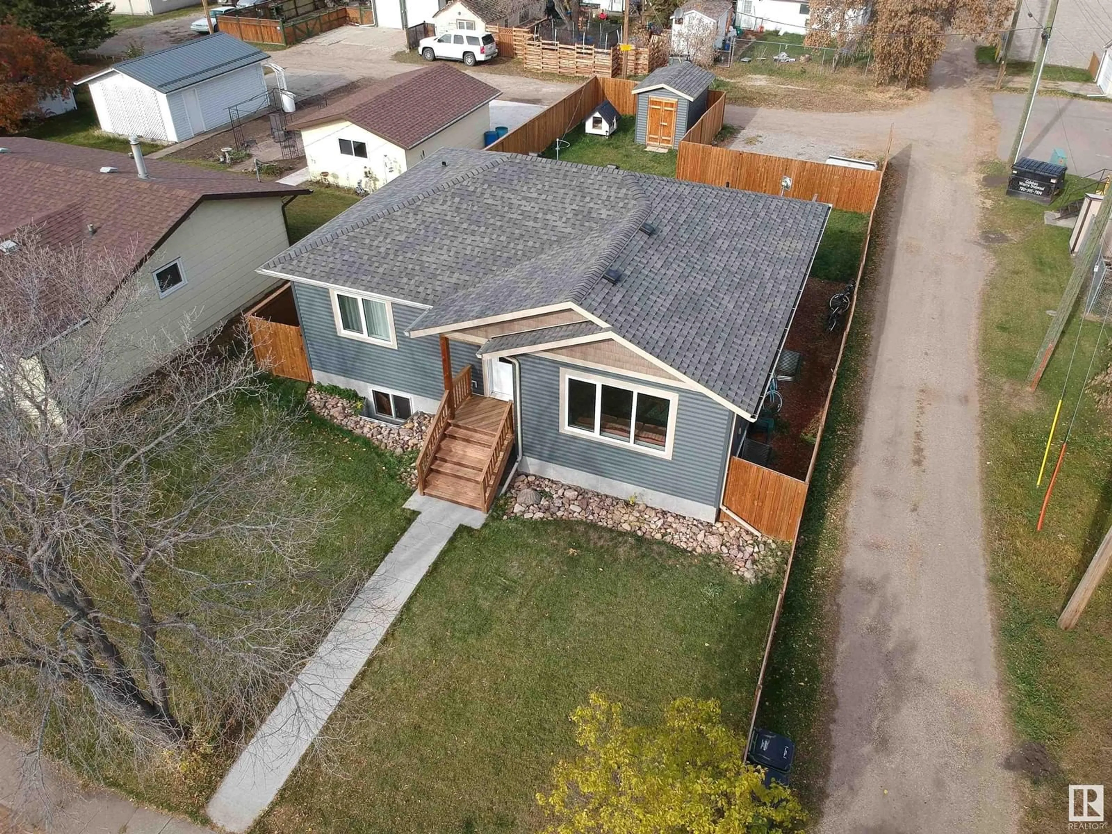 Frontside or backside of a home, the fenced backyard for 5012 48 AV, Onoway Alberta T0E1V0