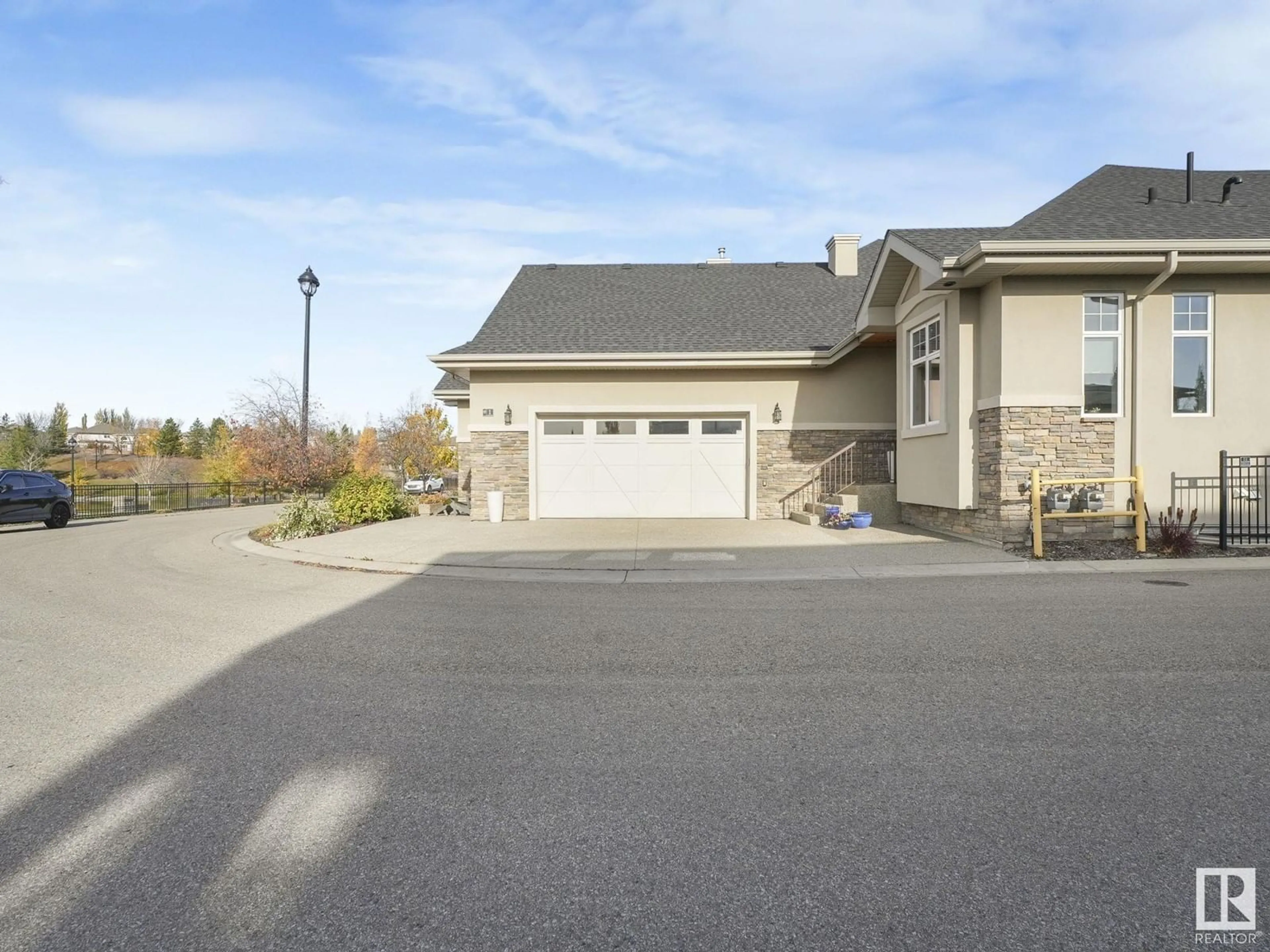 Frontside or backside of a home, the street view for #1 7570 MAY CM NW, Edmonton Alberta T6R0G9