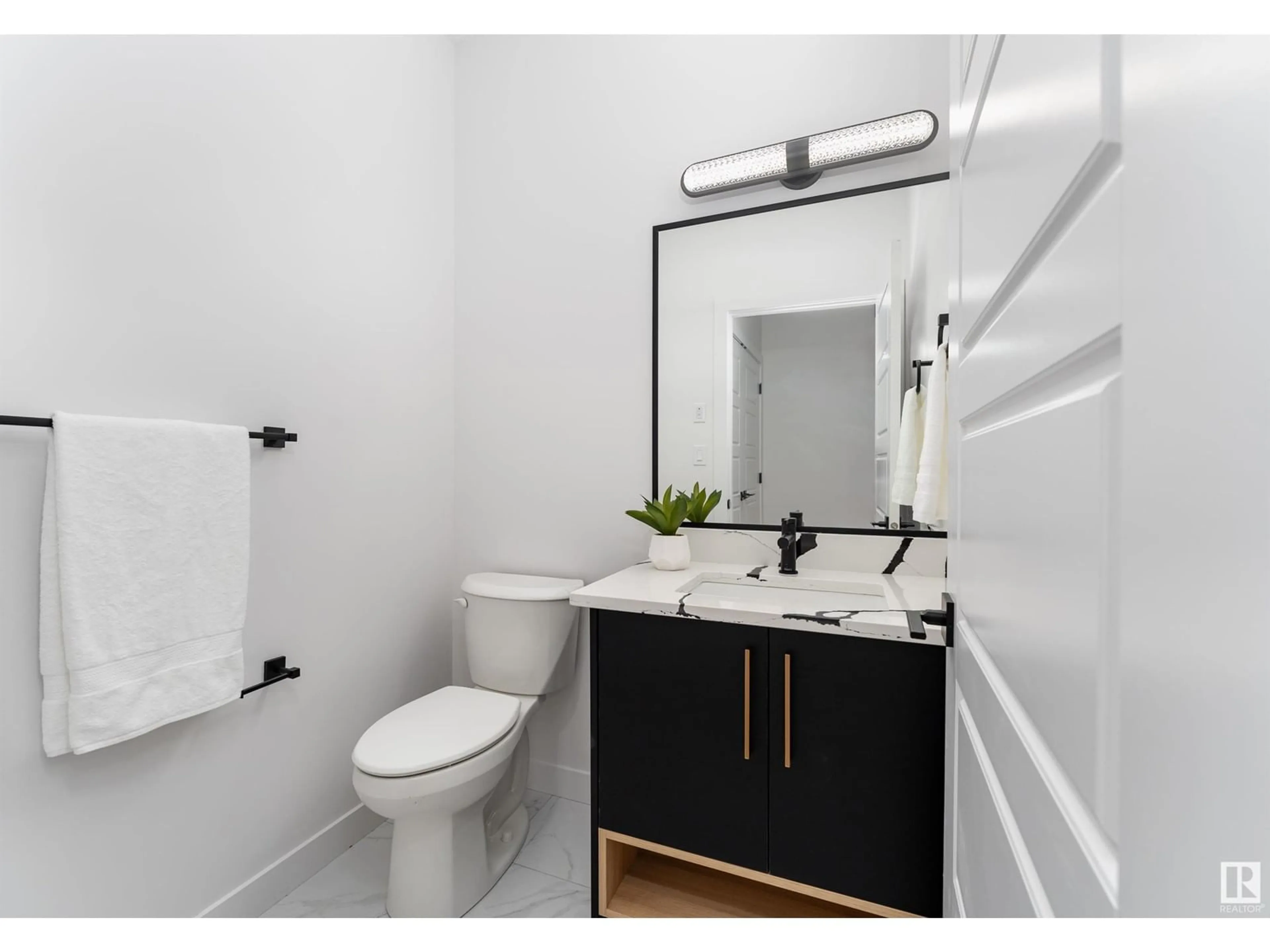 Standard bathroom, wood floors for 6923 JOHNNIE CAINE WY NW, Edmonton Alberta T5E6W4