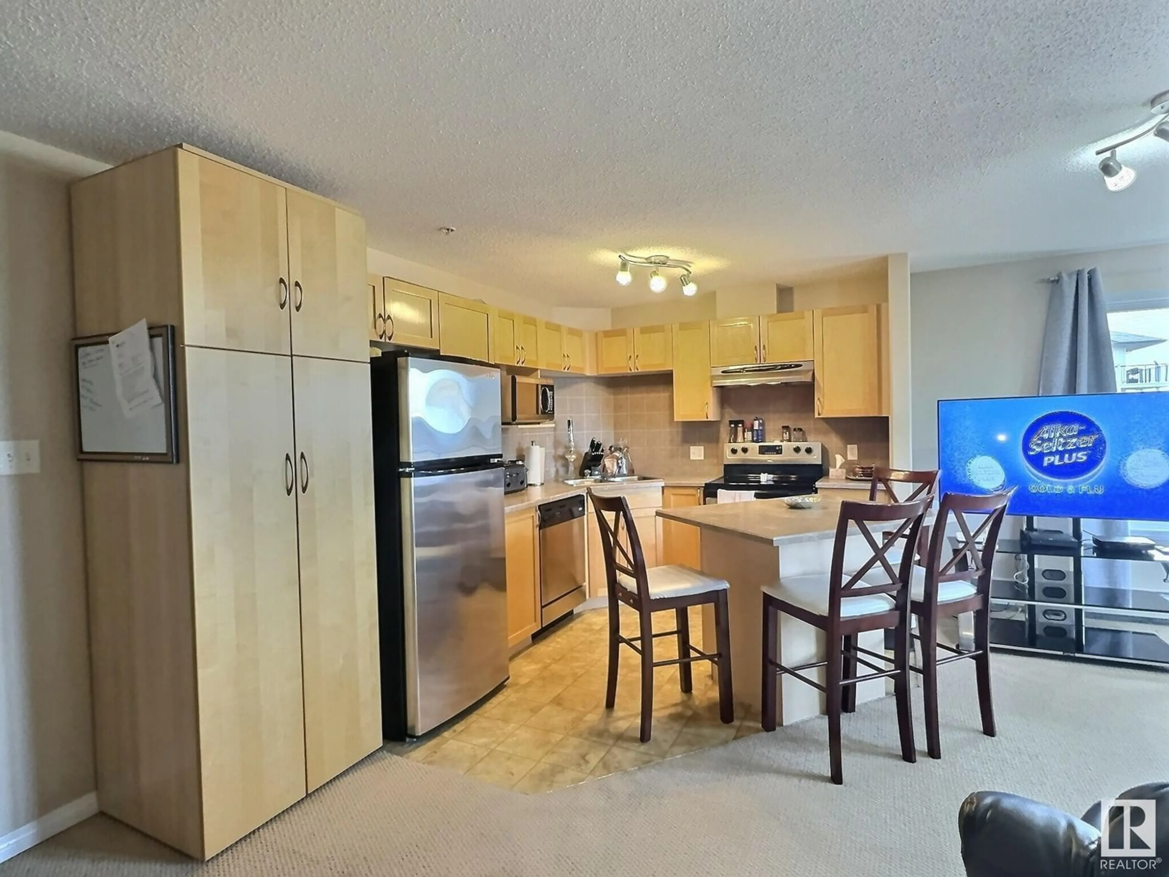 Open concept kitchen for #304 111 EDWARDS DR SW, Edmonton Alberta T6X0C4