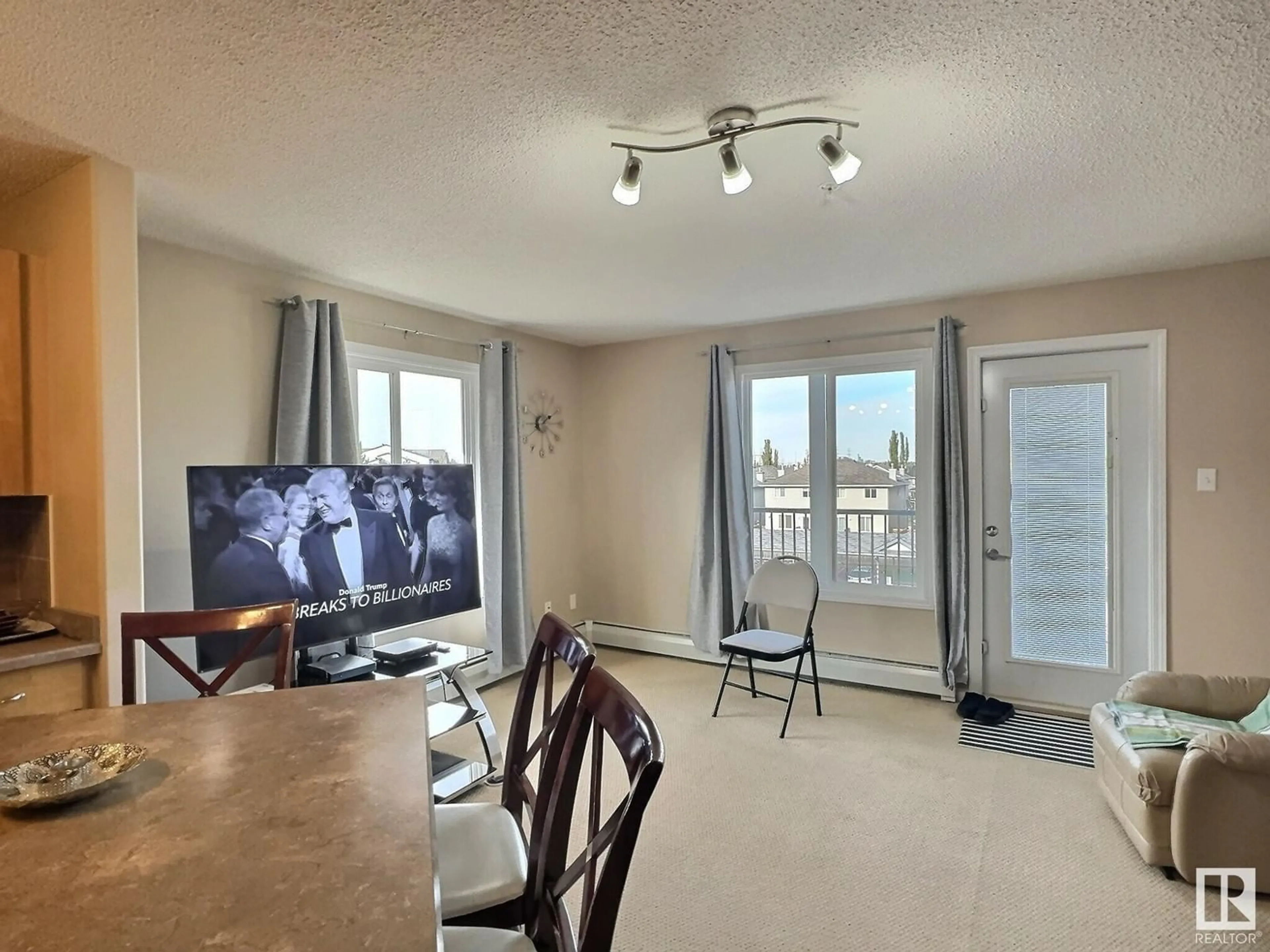 A pic of a room, wood floors for #304 111 EDWARDS DR SW, Edmonton Alberta T6X0C4