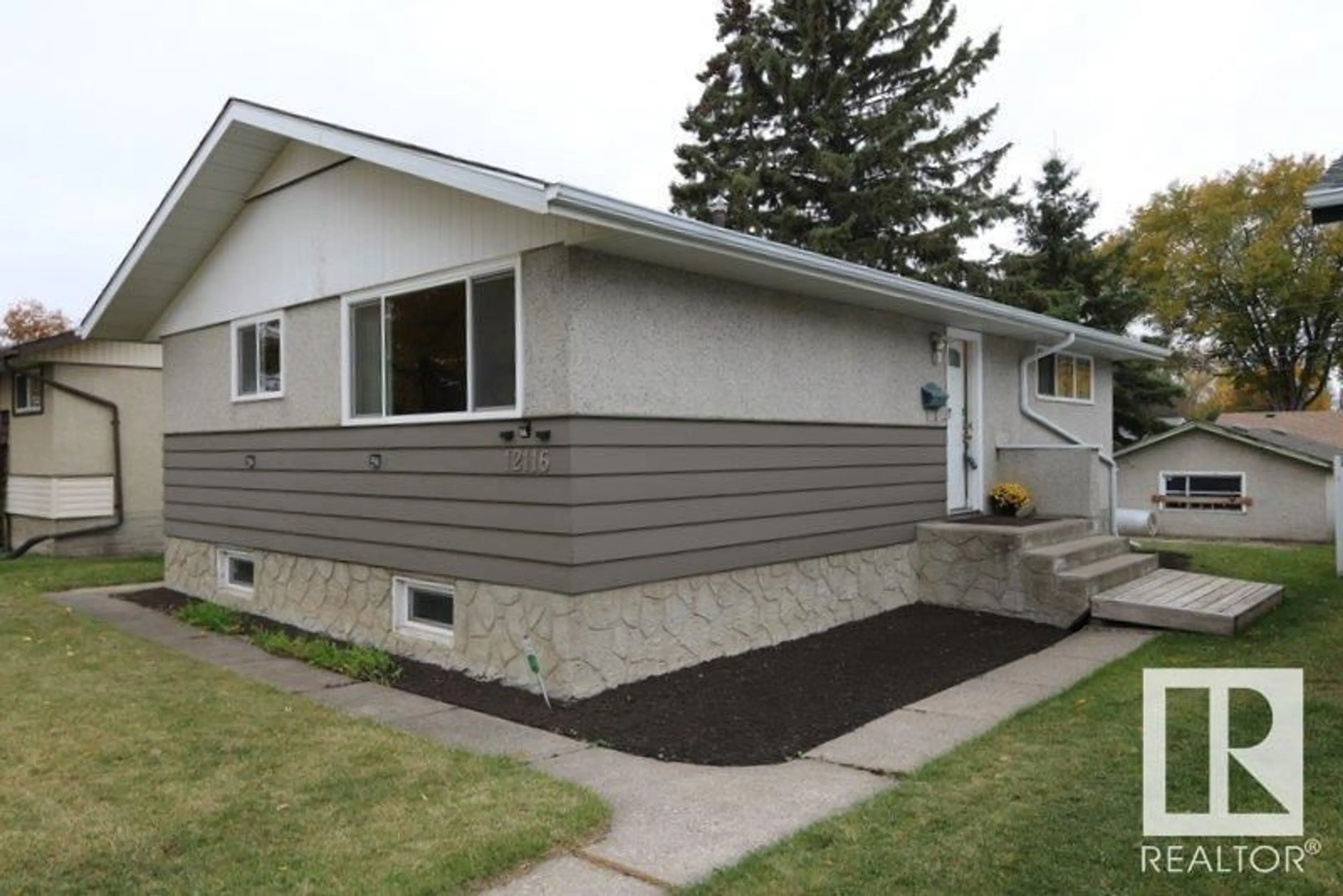 Home with vinyl exterior material for 12116 51 ST NW NW, Edmonton Alberta T5W3G9