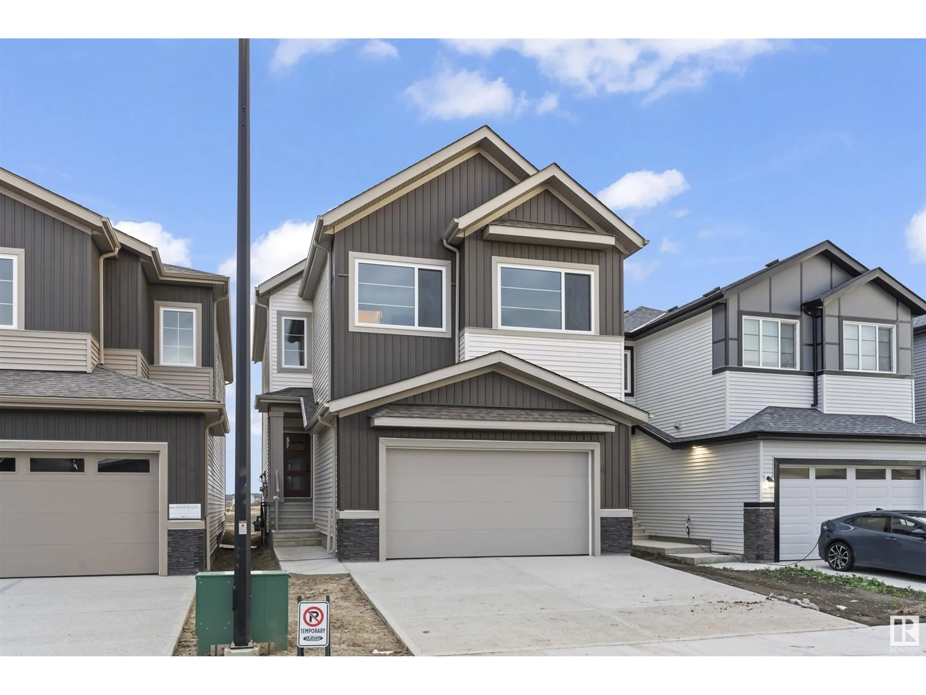 Frontside or backside of a home, the street view for 105 Miller WD, Leduc Alberta T9E1R7