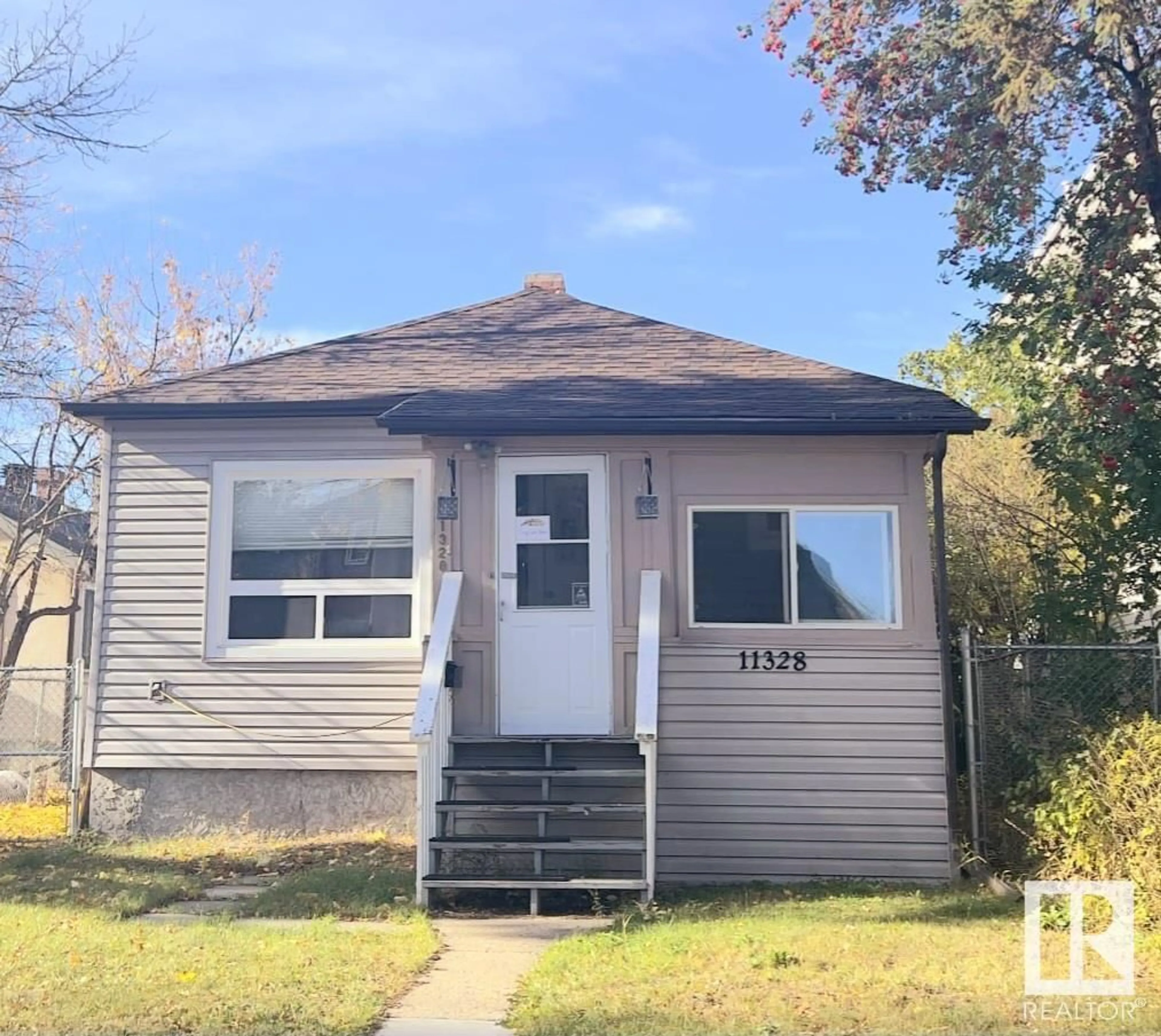 Frontside or backside of a home, the front or back of building for 11328 126 street NW ST NW, Edmonton Alberta T5M0R4