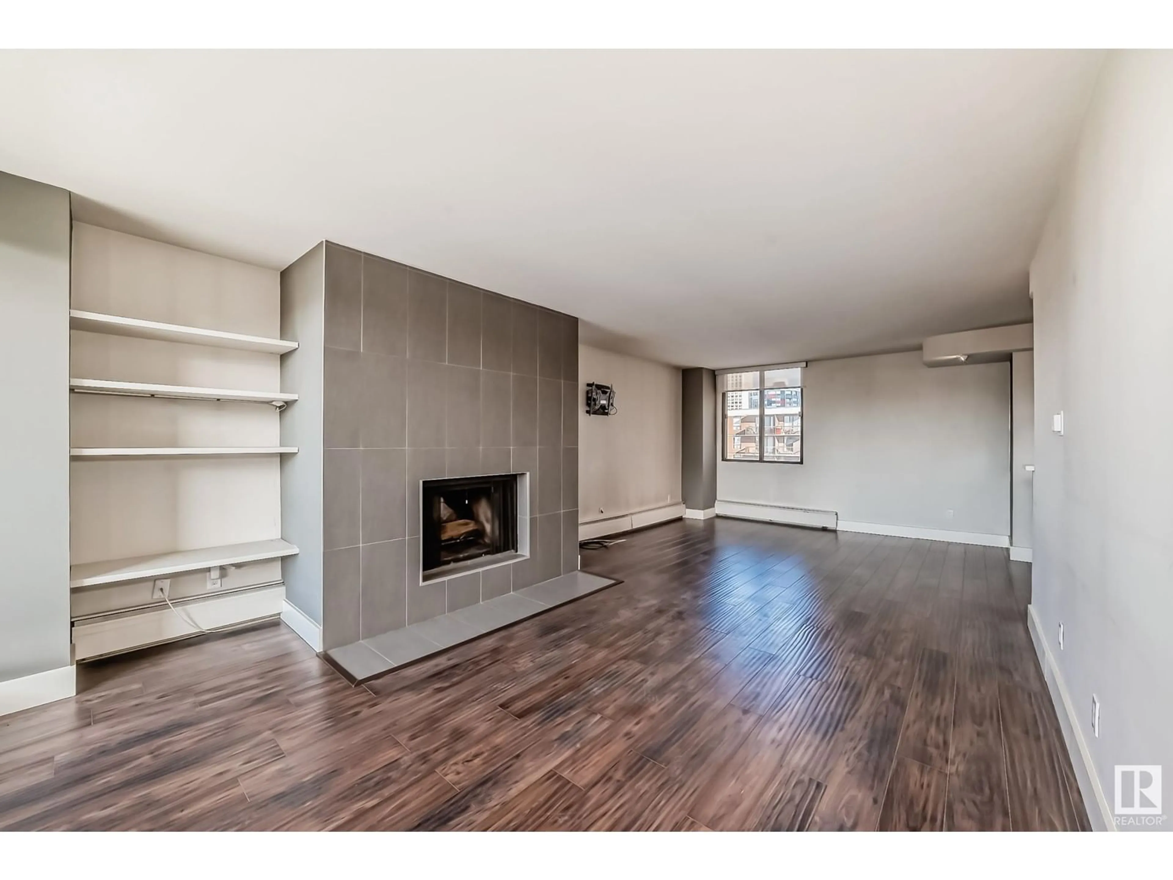 A pic of a room, wood floors for #1403 9921 104 ST NW, Edmonton Alberta T5K2K3