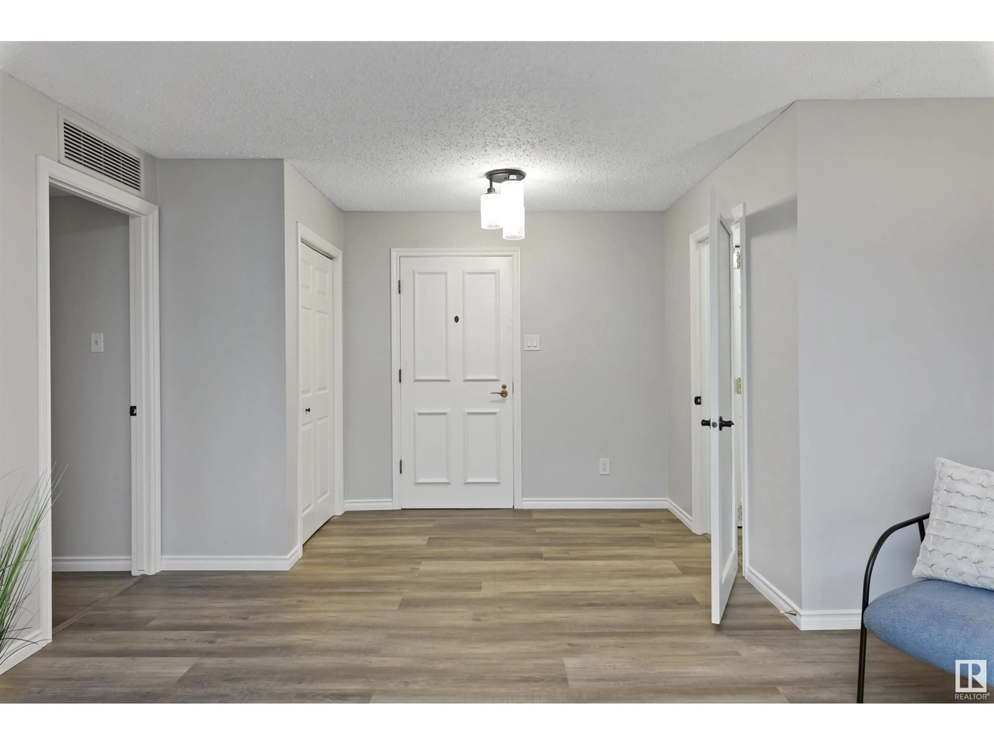 Indoor entryway, wood floors for #309 14810 51 AV NW, Edmonton Alberta T6H5G5