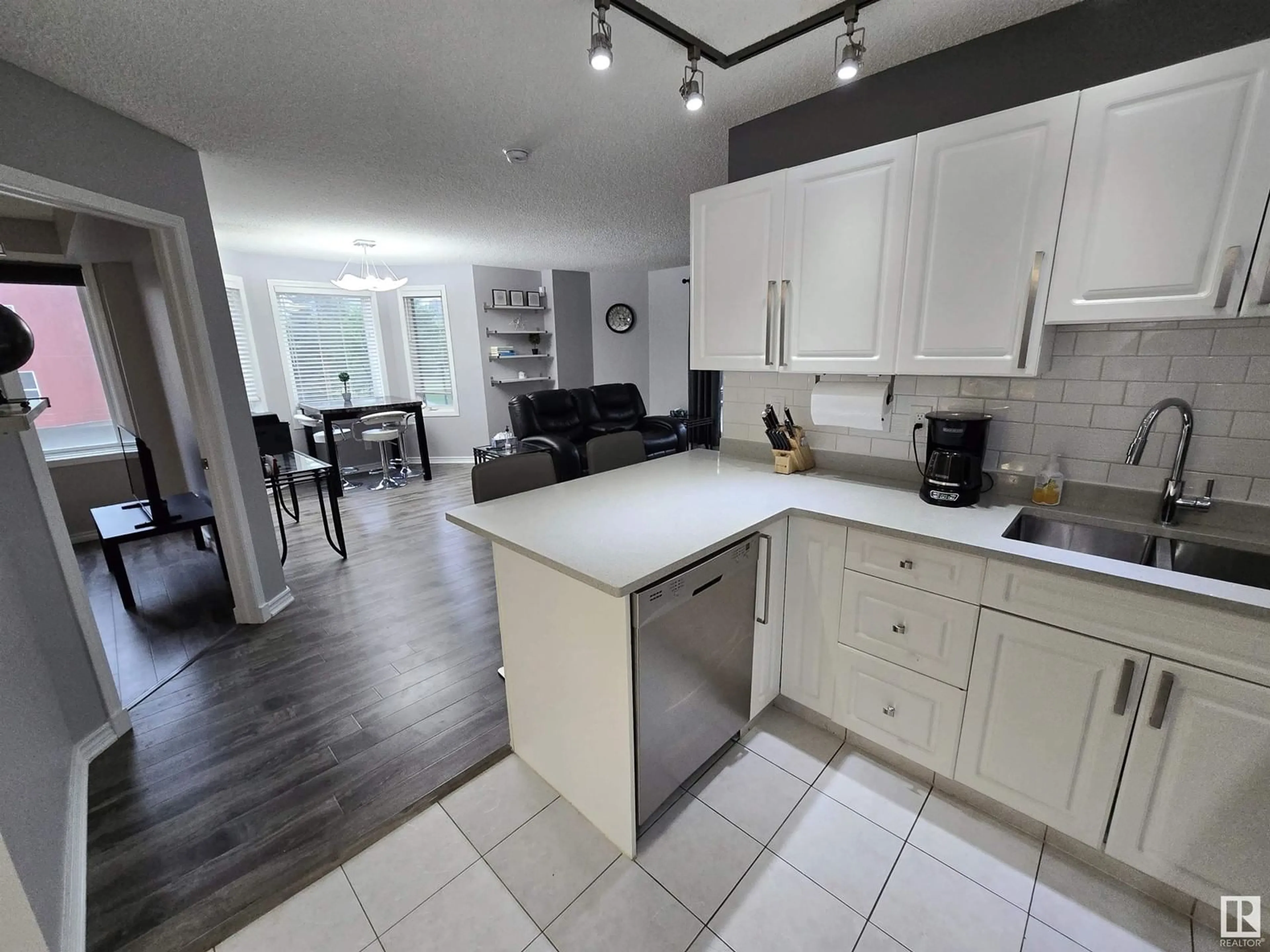 Open concept kitchen for #205 10909 103 AV NW, Edmonton Alberta T5K2W7