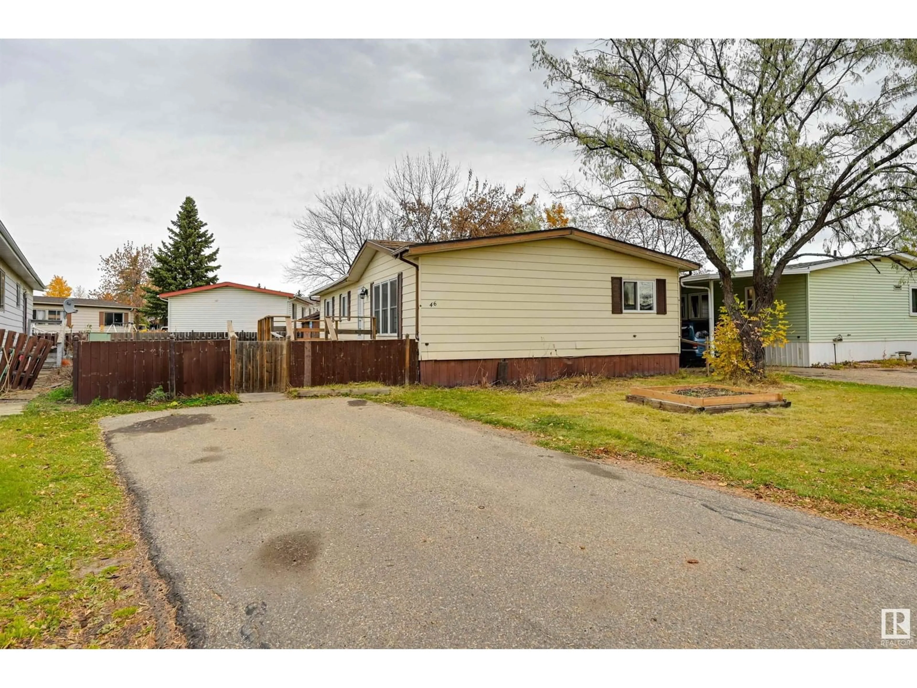 Frontside or backside of a home, the fenced backyard for 46 MAPLE TC NW NW, Edmonton Alberta T6P1H6