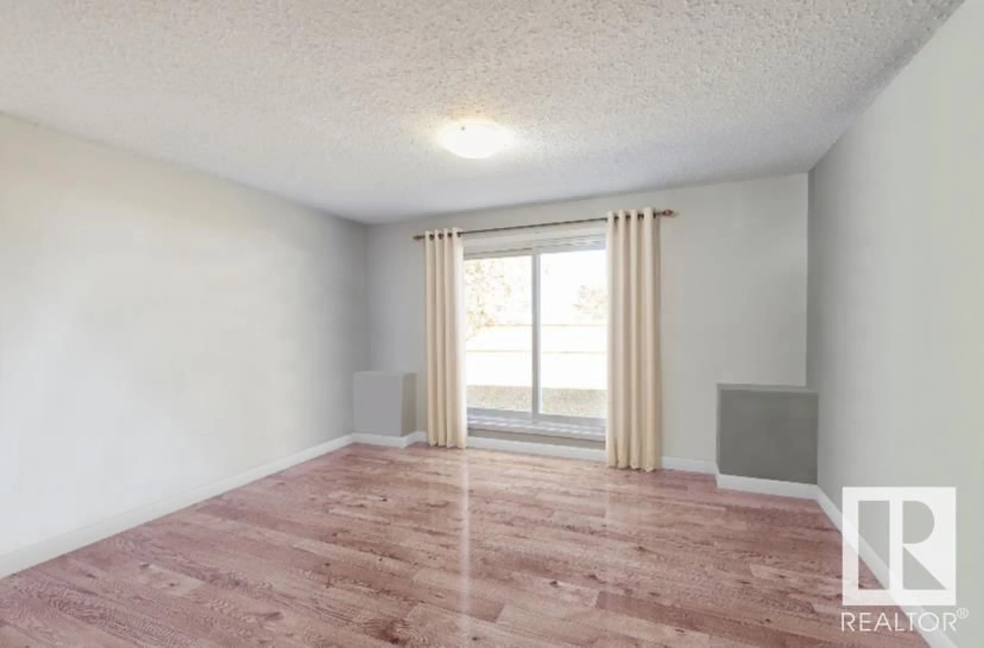 A pic of a room, wood floors for #141 3308 113 AV NW, Edmonton Alberta T5W5J8