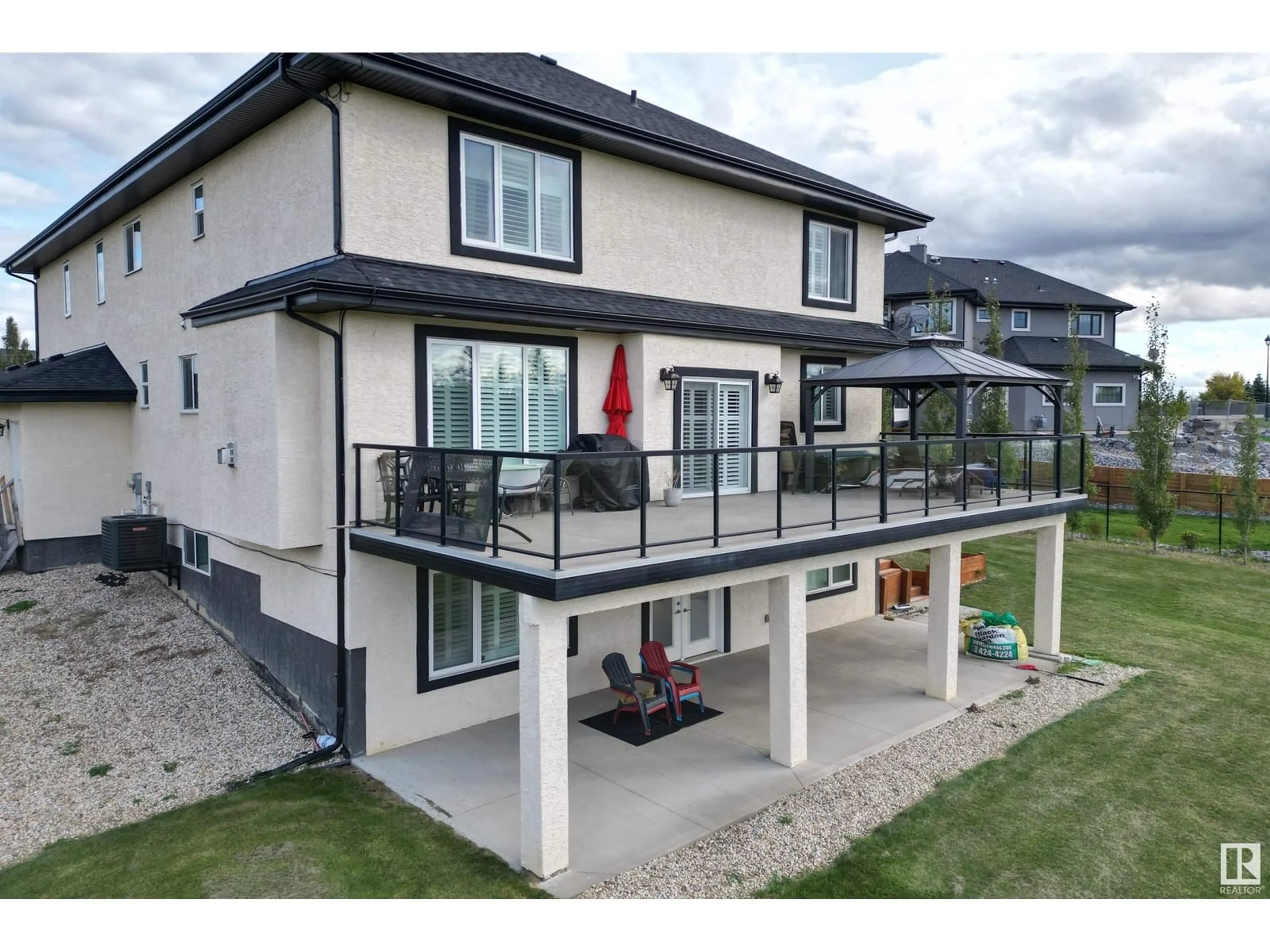 Frontside or backside of a home, the fenced backyard for #110 26116A HGHWAY 16, Rural Parkland County Alberta T7Y1A1